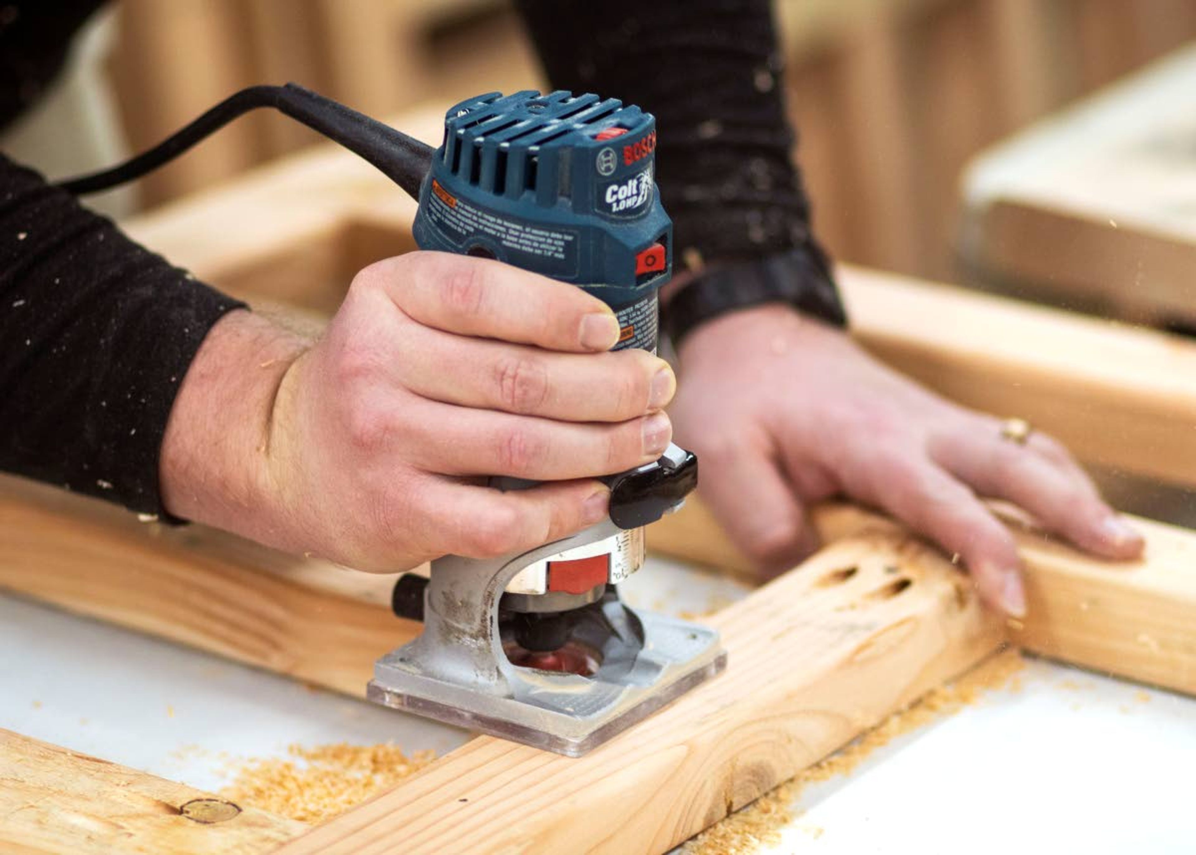 Volunteer Zachary Reid uses a router while helping build bunk beds Feb. 7 at Thad DeBuhr’s home in Pullman. The beds are being built through Blessing Beds, which donates beds to local children who would otherwise sleep on the floor.