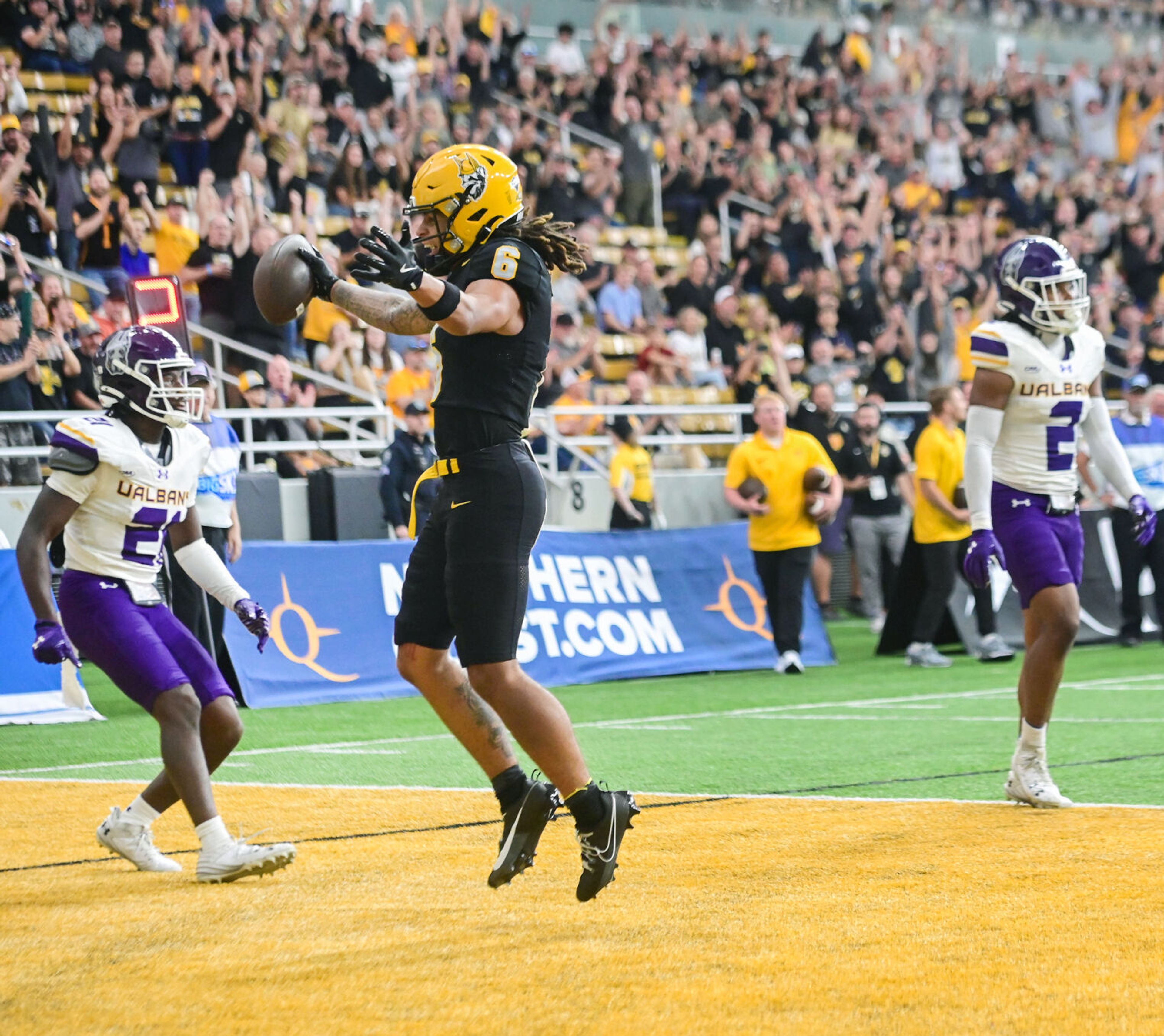 Idaho Vandals wide receiver Jordan Dwyer jumps after landing a catch in the end zone Saturday during a game against UAlbany at the P1FCU Kibbie Dome in Moscow.