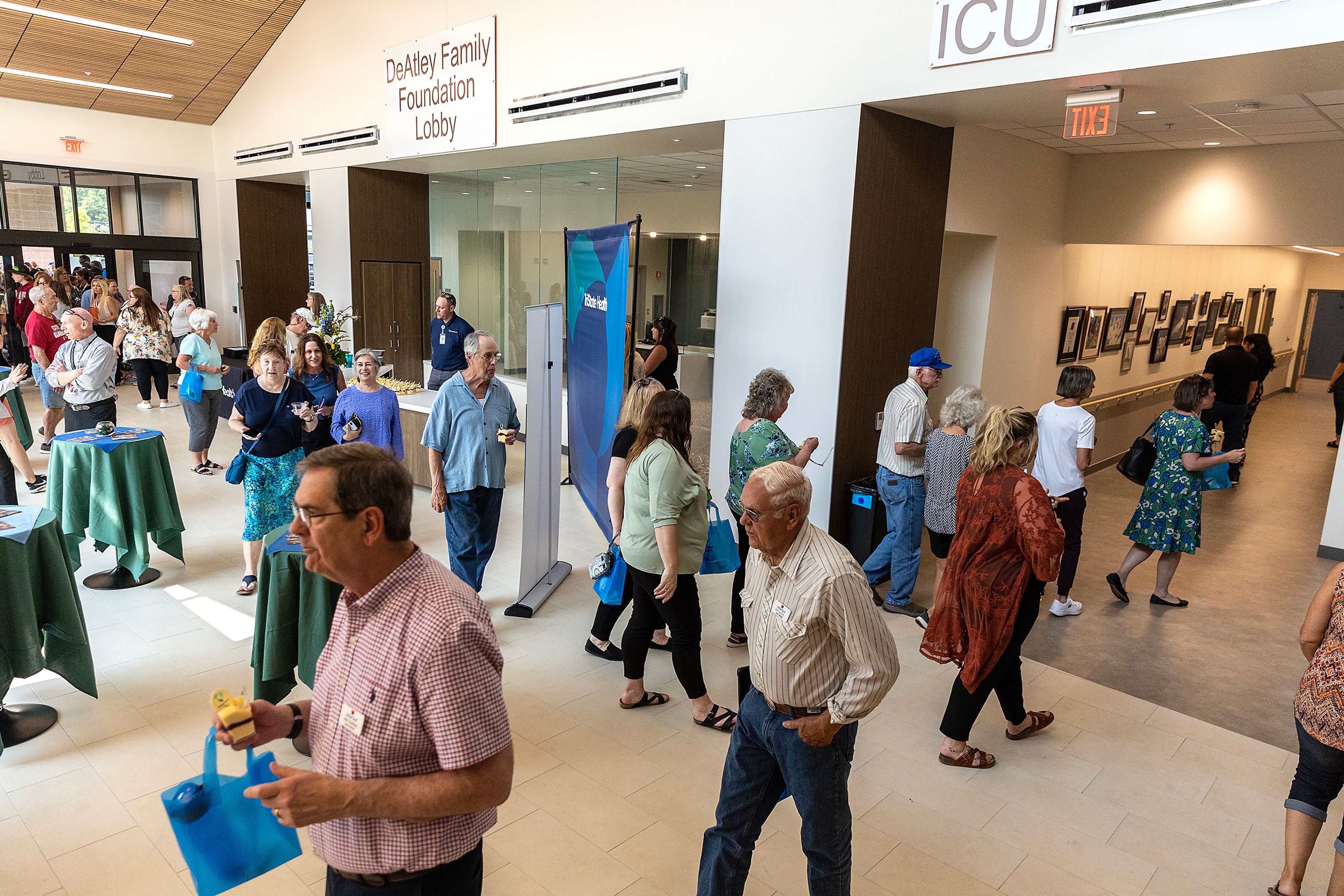 People walk through the lobby of the new TriState Health Inpatient and Dietary Wing on Friday, May 19 in Clarkston. The wing is scheduled to open after a two-month delay.