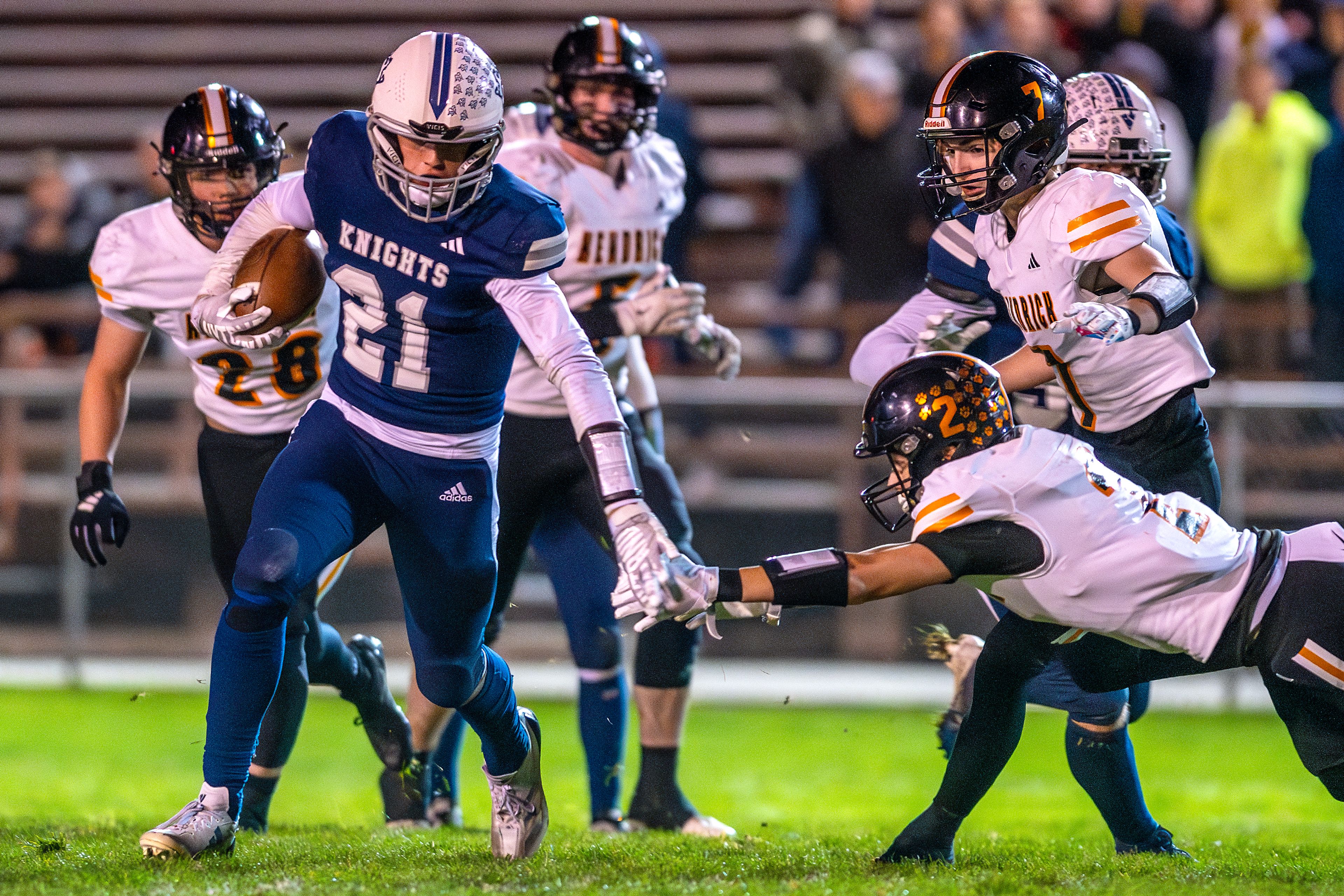 Logos wide receiver Baxter Covington avoids Kendrick defensive back Ralli Roetcisoender in a semifinal game of the Idaho State Football Class 2A Championships Friday at Bengal Field in Lewiston.