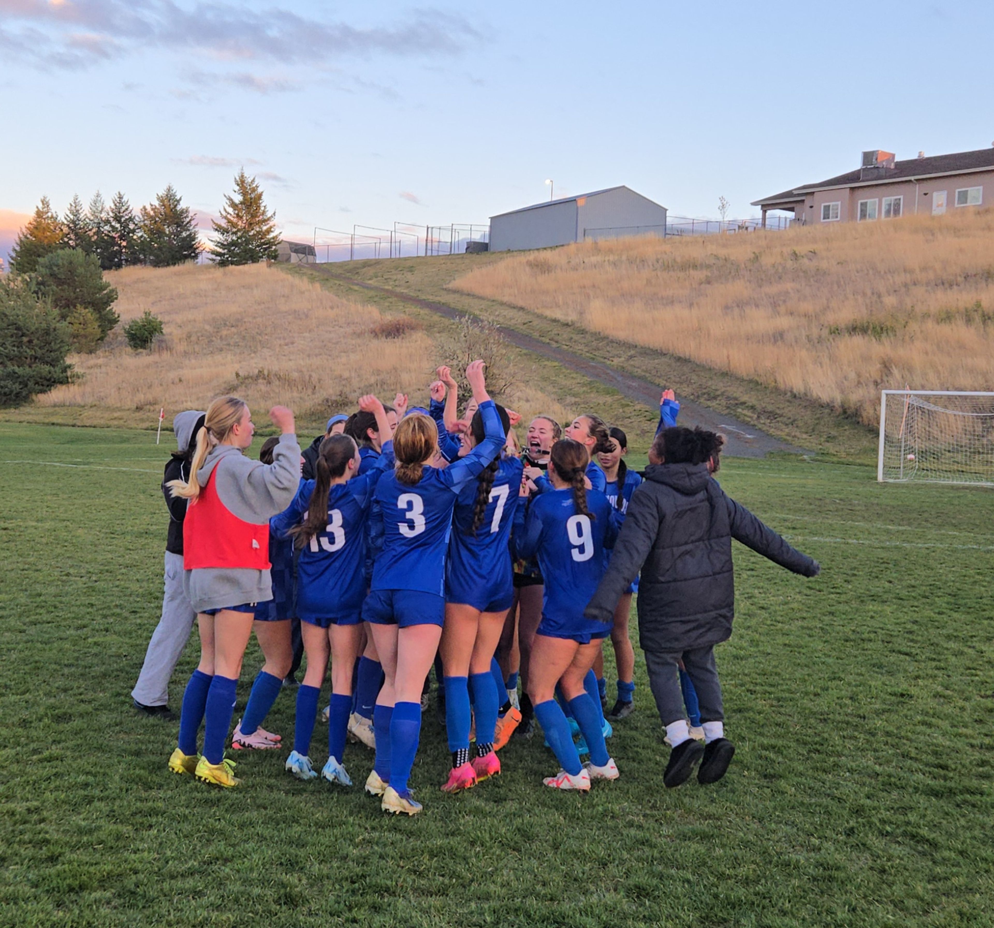 The Pullman girls soccer team huddles up after defeating Clarkston in a district tournament game Tuesday at Pullman High School.