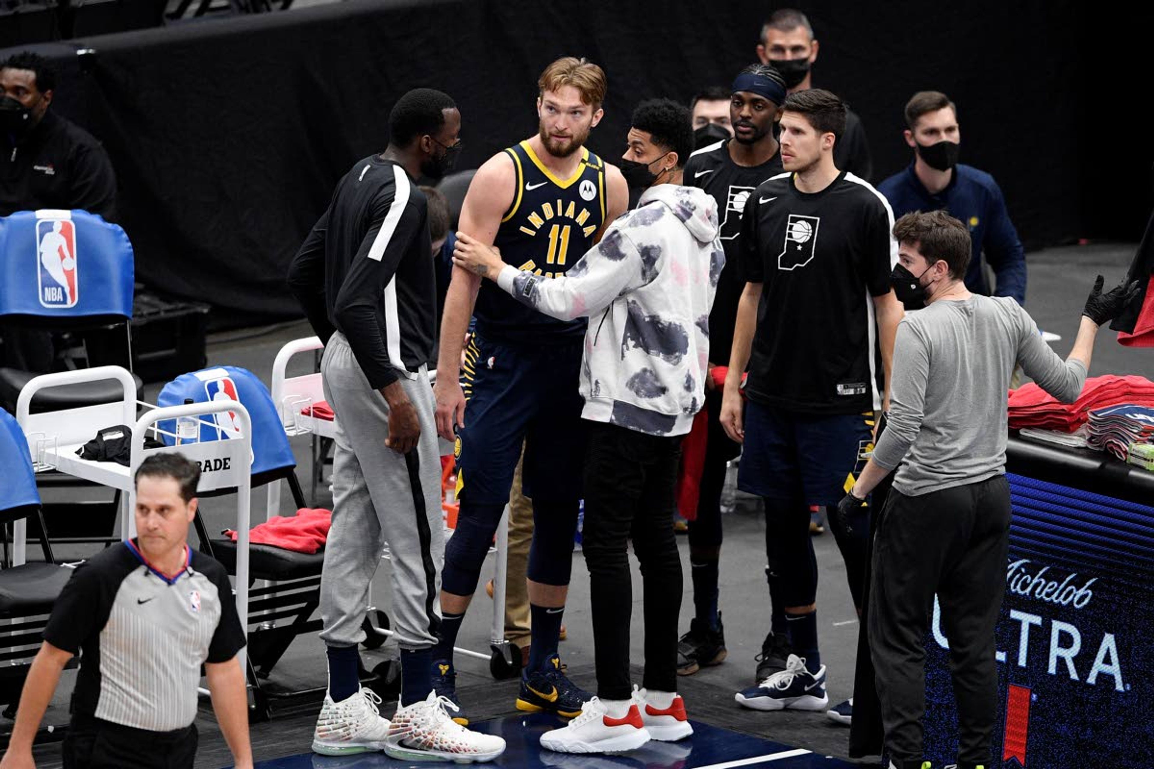 Indiana Pacers forward Domantas Sabonis (11) reacts with teammates in the bench area after fouling out during the second half of the team's NBA basketball Eastern Conference play-in game against the Washington Wizards, Thursday, May 20, 2021, in Washington. (AP Photo/Nick Wass)