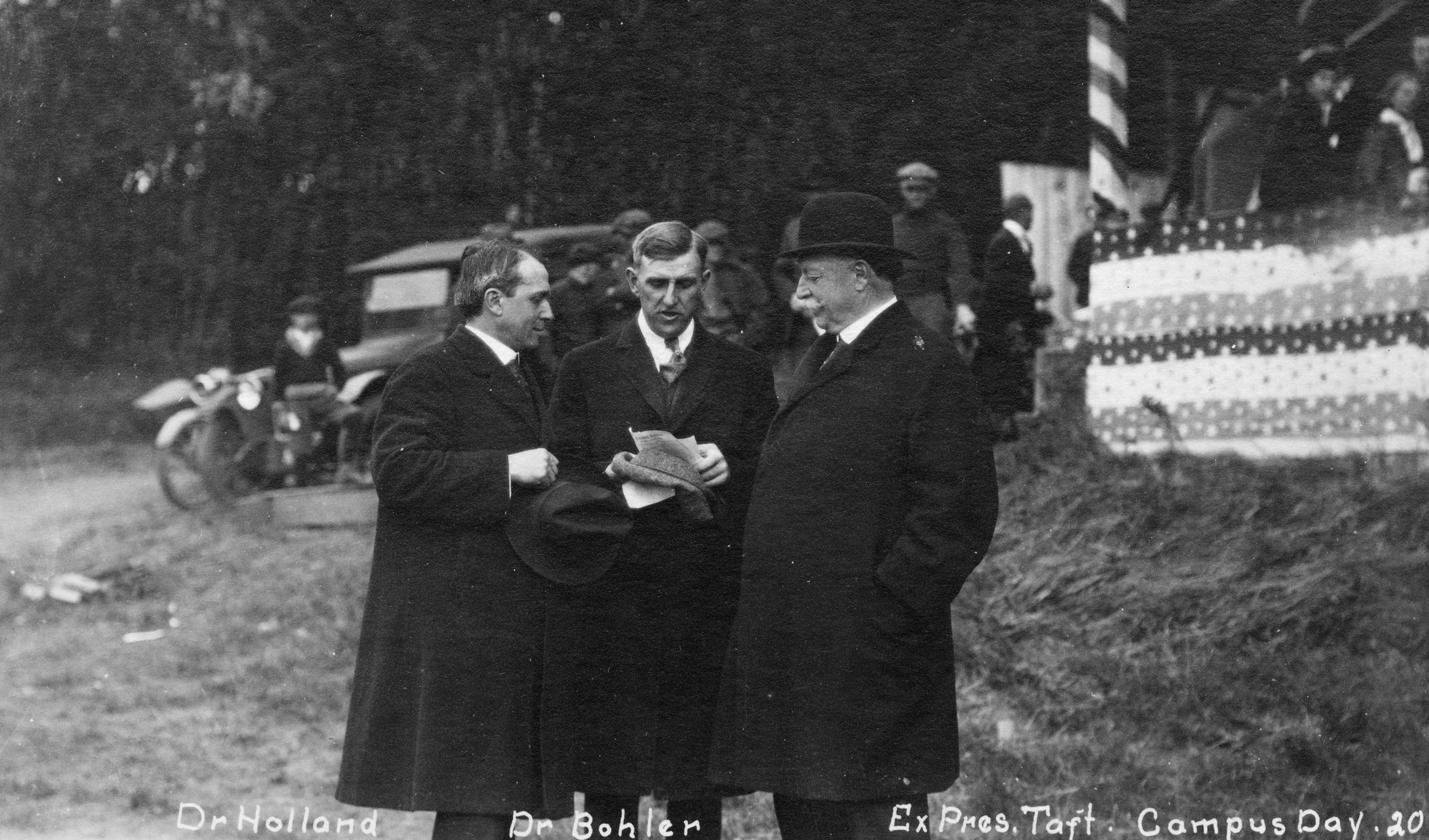 Washington State College President E.O. Holland, from left, athletic director Doc Bohler and former U.S. President William Taft go over the day�s plans on Rogers Field.