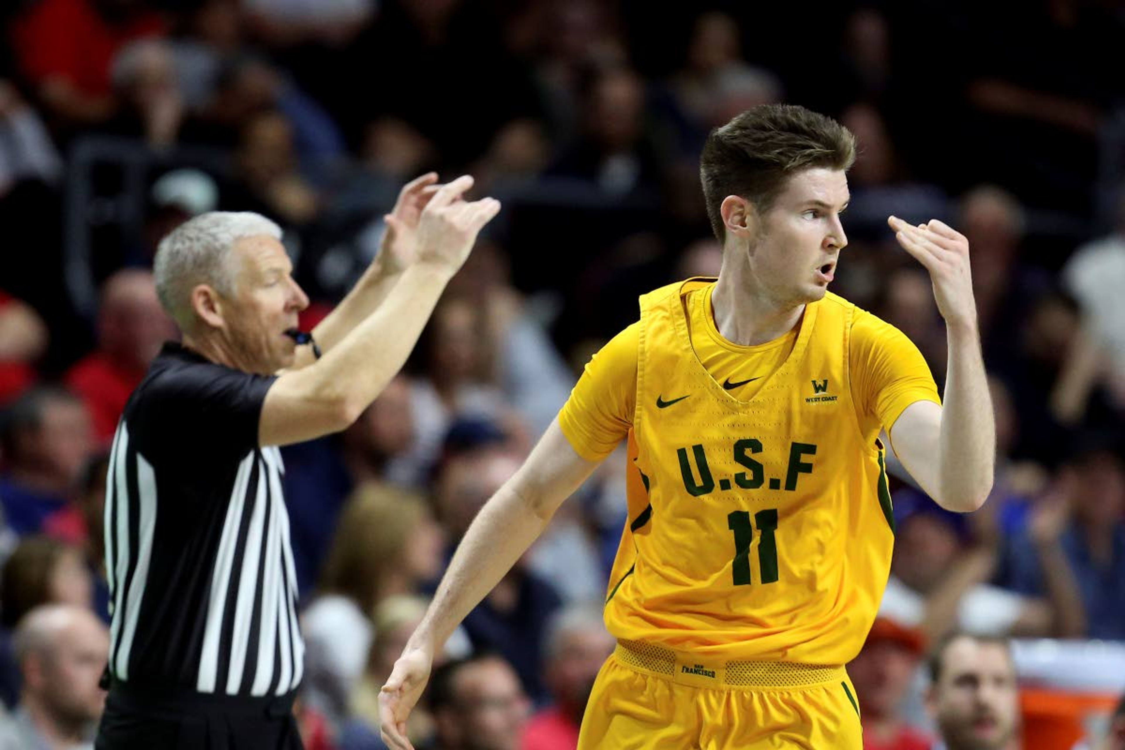 San Francisco's Remu Raitanen reacts after scoring a three-point basket during the first half of an NCAA college basketball game against Gonzaga in the West Coast Conference men's tournament Monday, March 9, 2020, in Las Vegas. (AP Photo/Isaac Brekken)