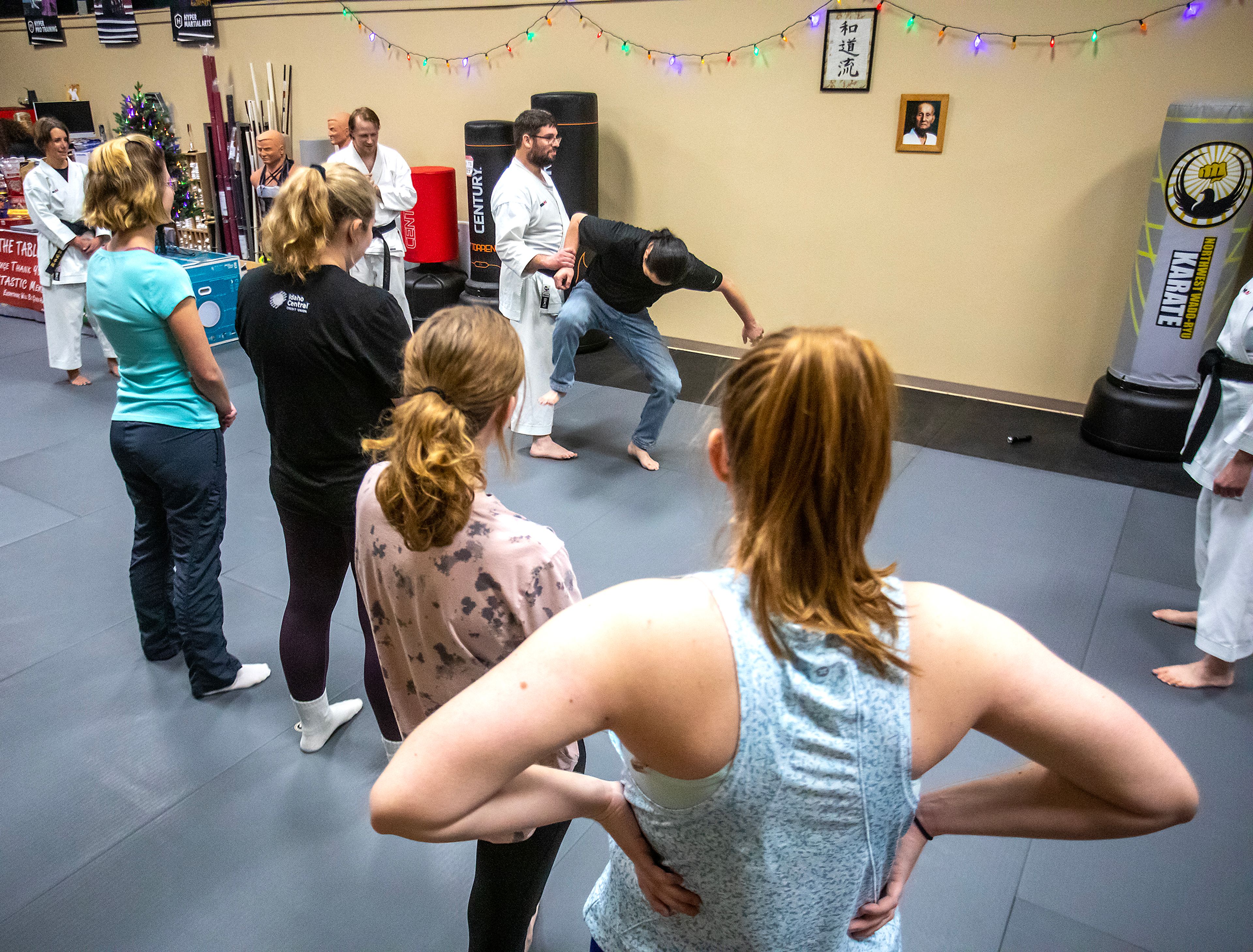 Chris Schwartz shows how one would want to step down on a potential attackers foot in his self-defense class at Northwest Wado-ryu karate Thursday last week in Moscow.