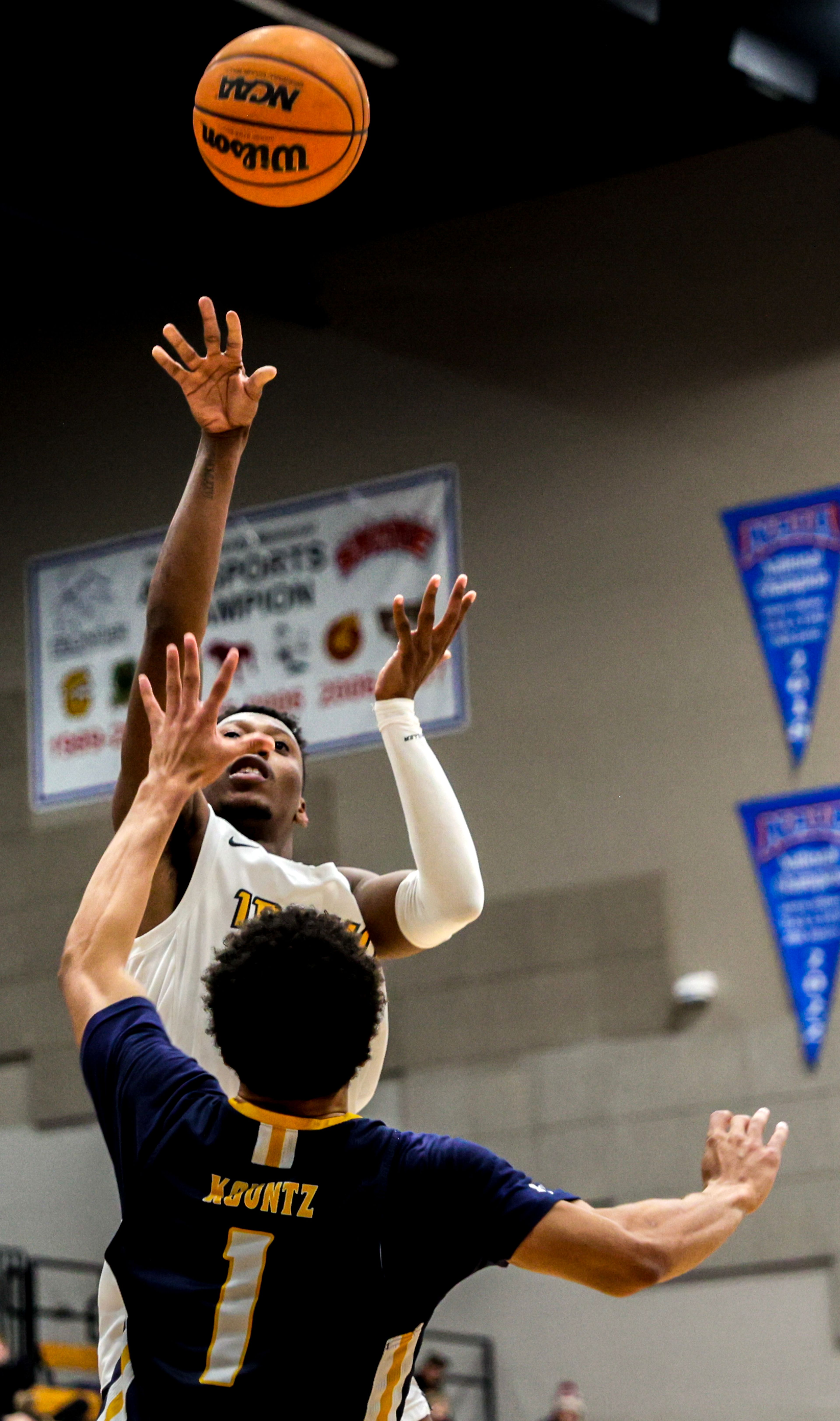 Idaho guard Divant'e Moffitt shoots over Northern Colorado guard Daylen Kountz in a Big Sky game at the P1FCU Activity Center on the Lewis-Clark State College campus Thursday in Lewiston.