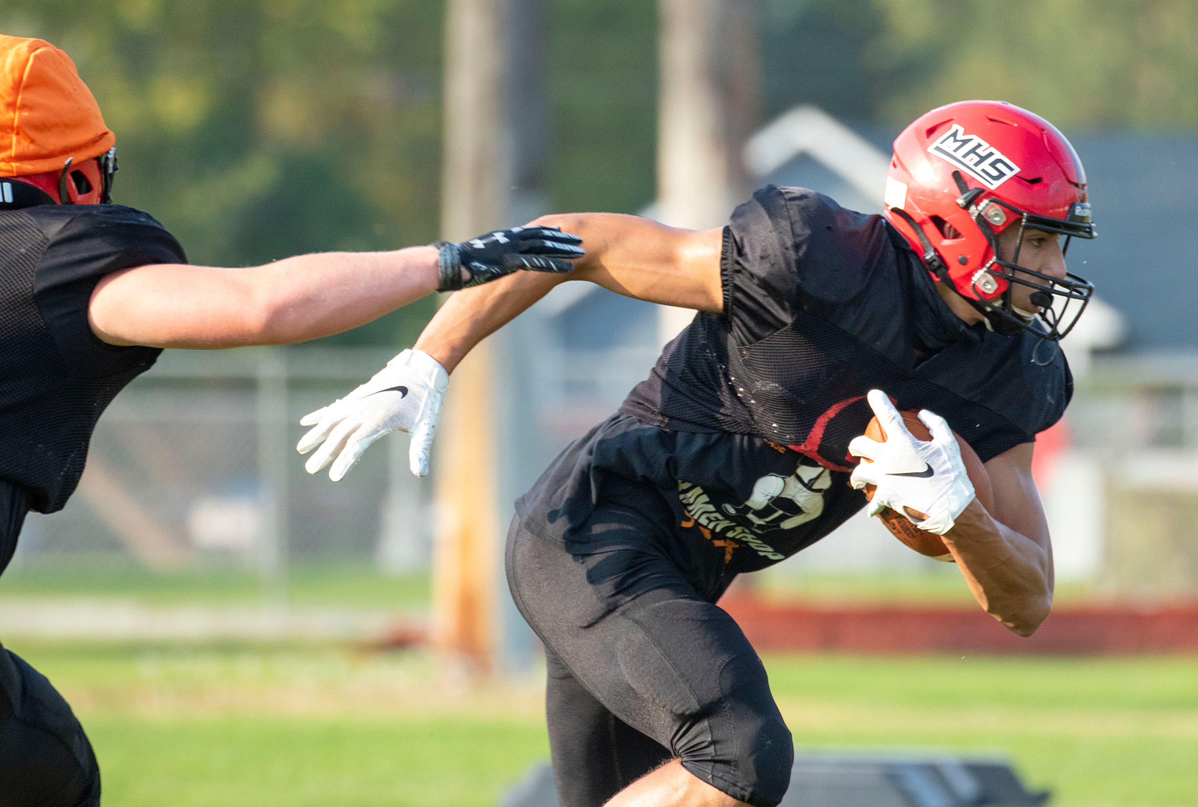 Moscow tight end Jonah Elliss, right, carries the ball during a practice on Sept. 23, 2020, in Moscow.