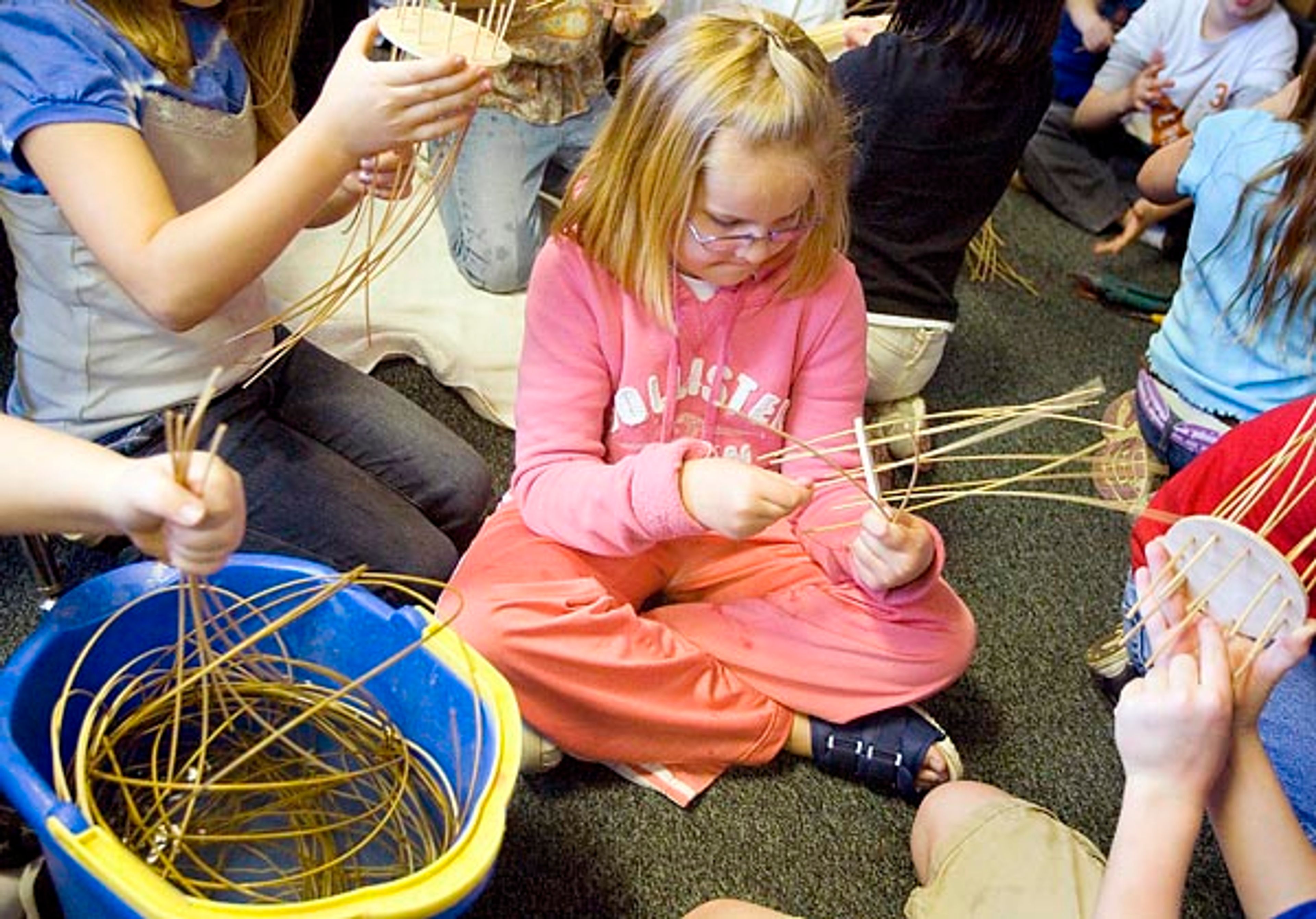 Third-grader Selma Marteinsdottir and her classmates weave reed
baskets during art day at Lena Whitmore Elementary School in Moscow
on Friday. Martina Ederer of Moscow tought the basket-weaving
class.