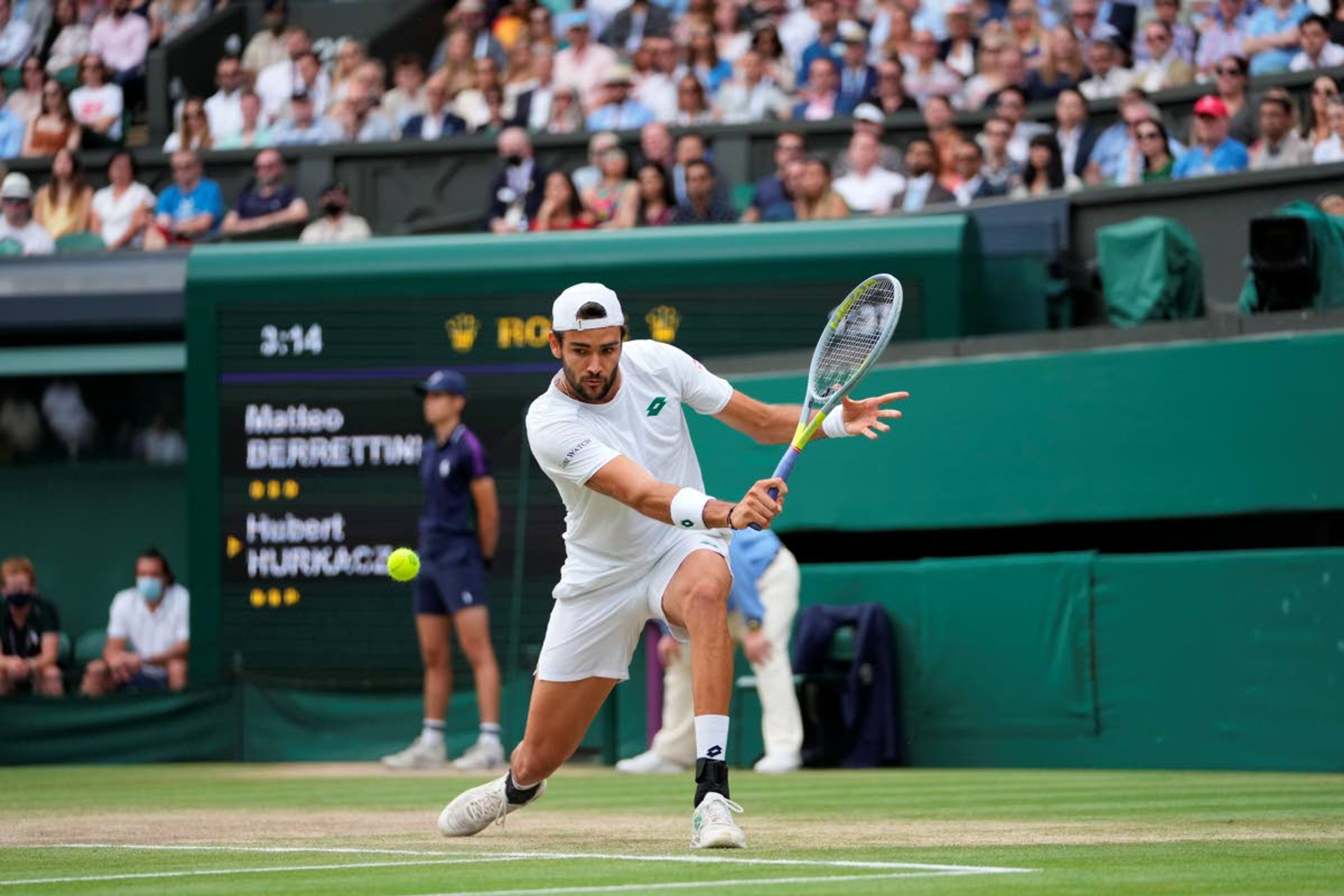 Italy's Matteo Berrettini plays a return to Poland's Hubert Hurkacz during the men's singles semifinals match on day eleven of the Wimbledon Tennis Championships in London, Friday, July 9, 2021. (AP Photo/Alberto Pezzali)