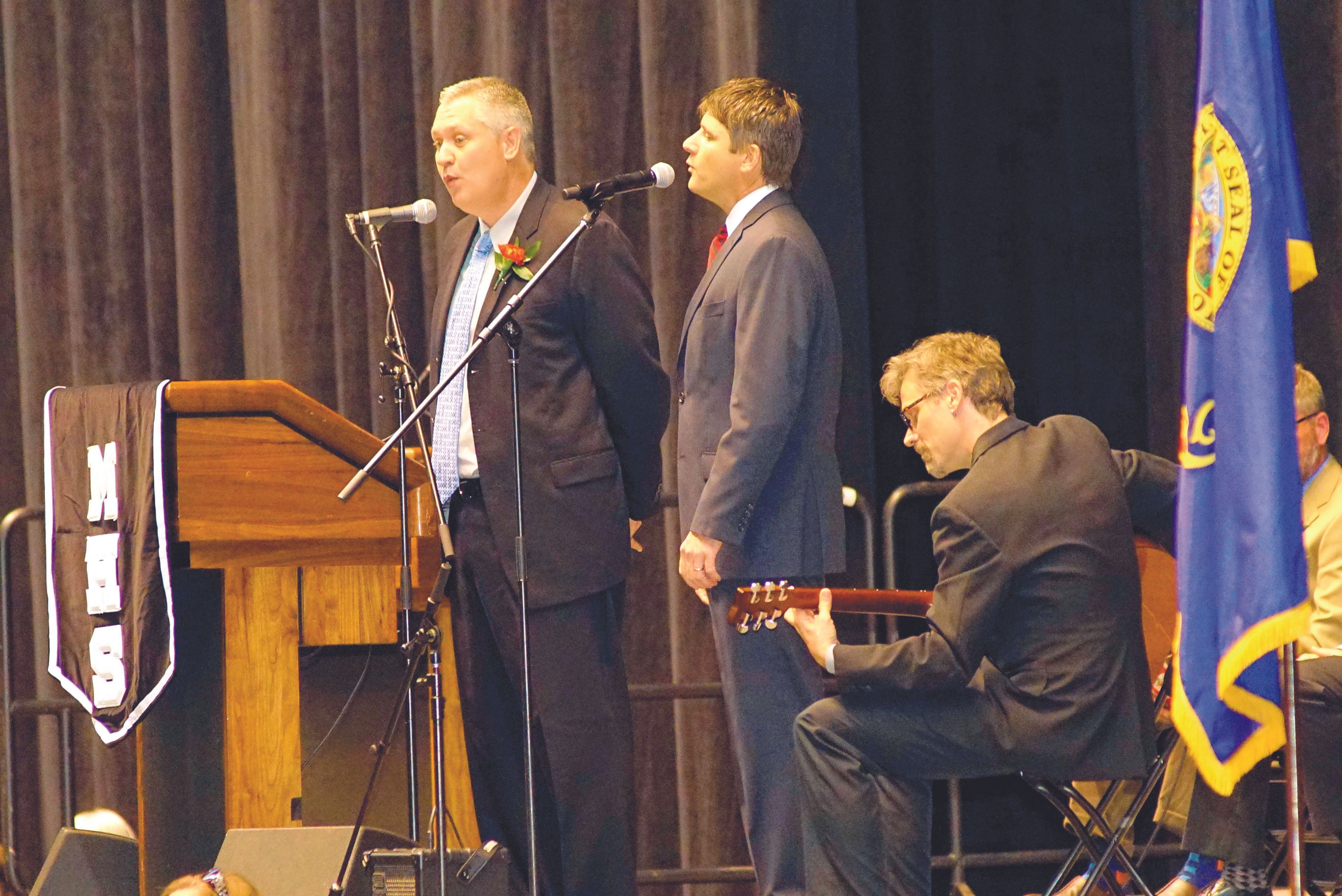 Sam Hoogsteen, left, Mike Hightower and Tim Gregory on guitar serenade the class of 2017 with a rendition of Paul McCartney's "Blackbird" as part of Hoogsteen's commencement address to Moscow High School's graduating class Friday night.