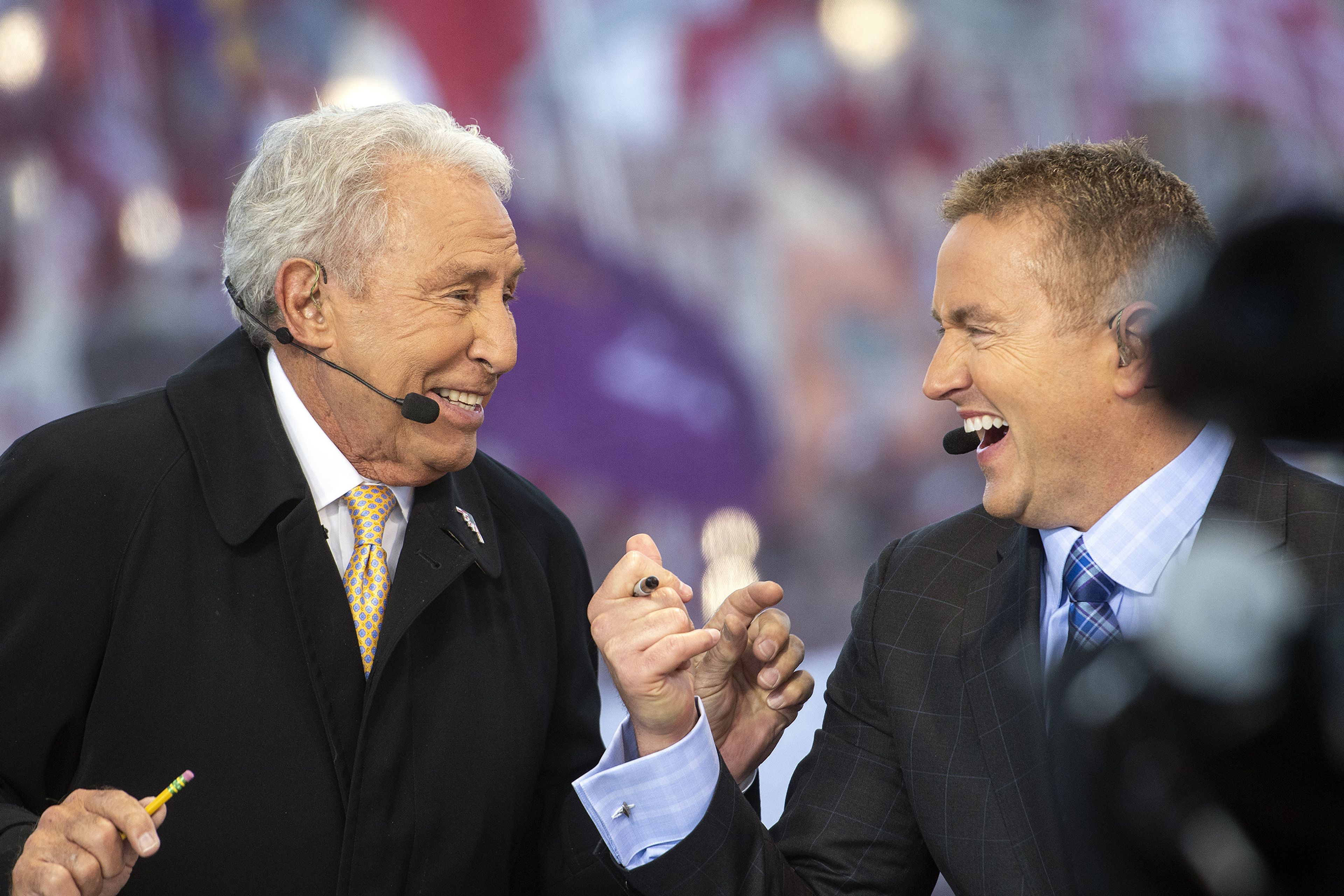 ESPN College GameDay analysts Lee Corso, left, and Kirk Herbstreit share a moment as they make their weekly college football picks on Saturday morning on the set in Pullman.