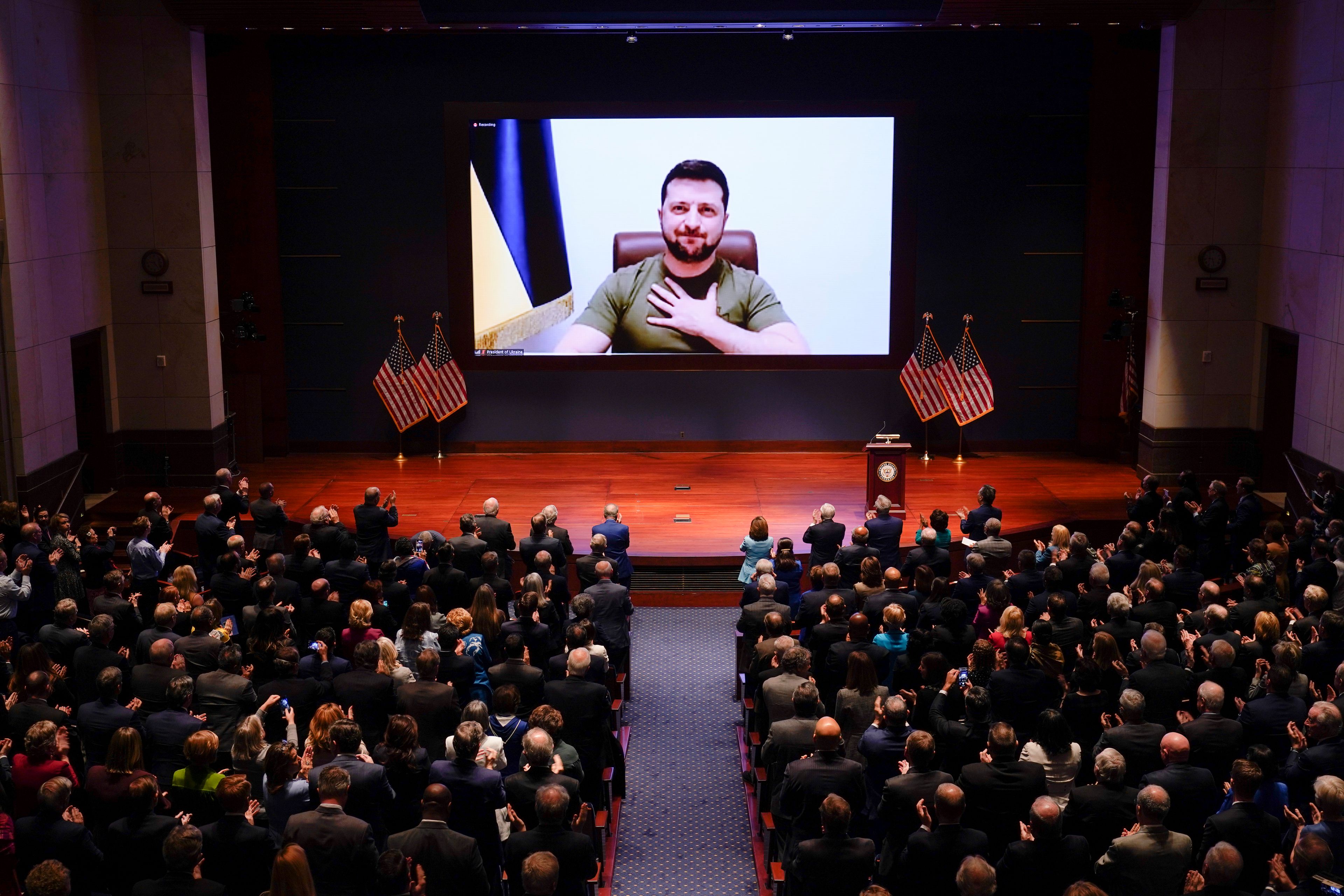 Ukrainian President Volodymyr Zelenskyy speaks to the U.S. Congress by video to plead for support as his country is besieged by Russian forces, at the Capitol in Washington, Wednesday, March 16, 2022. (AP Photo/J. Scott Applewhite, Pool)