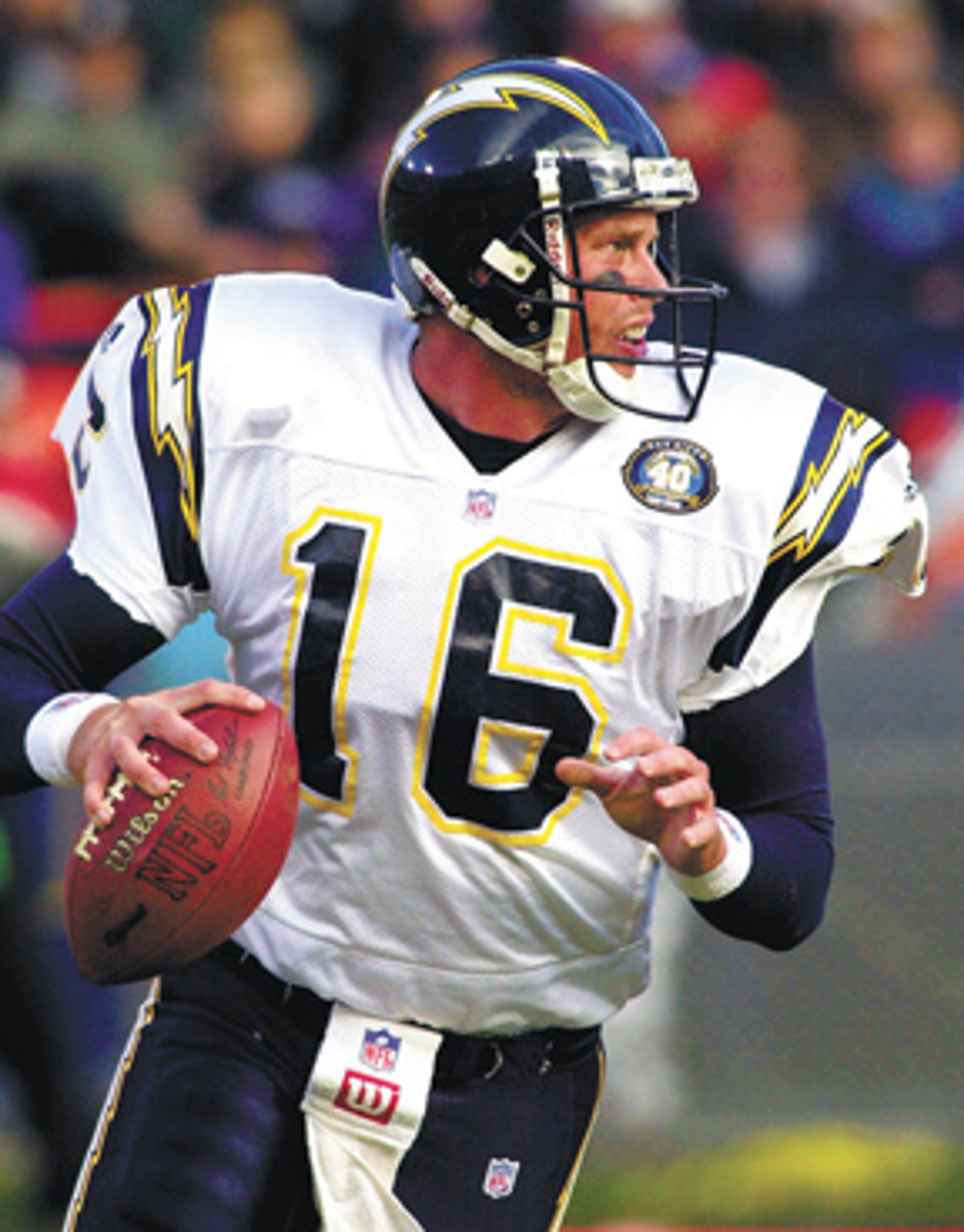 FILE - In this Nov. 19, 2000 file photo, San Diego Chargers
quarterback Ryan Leaf rolls out of the pocket as he looks for a
receiver in the first quarter of an NFL football game against the
Denver Broncos in Denver. Leaf could face radiation treatments if
part of a brain tumor that couldn't be removed winds up growing.
Leaf told The Associated Press on Thursday, June 2, 2011, that the
California doctor who performed the surgery couldn't get all of the
tumor because parts were wrapped around brain stem nerves that
affect swallowing and shoulder movement. (AP Photo/Kevin Higley,
File)