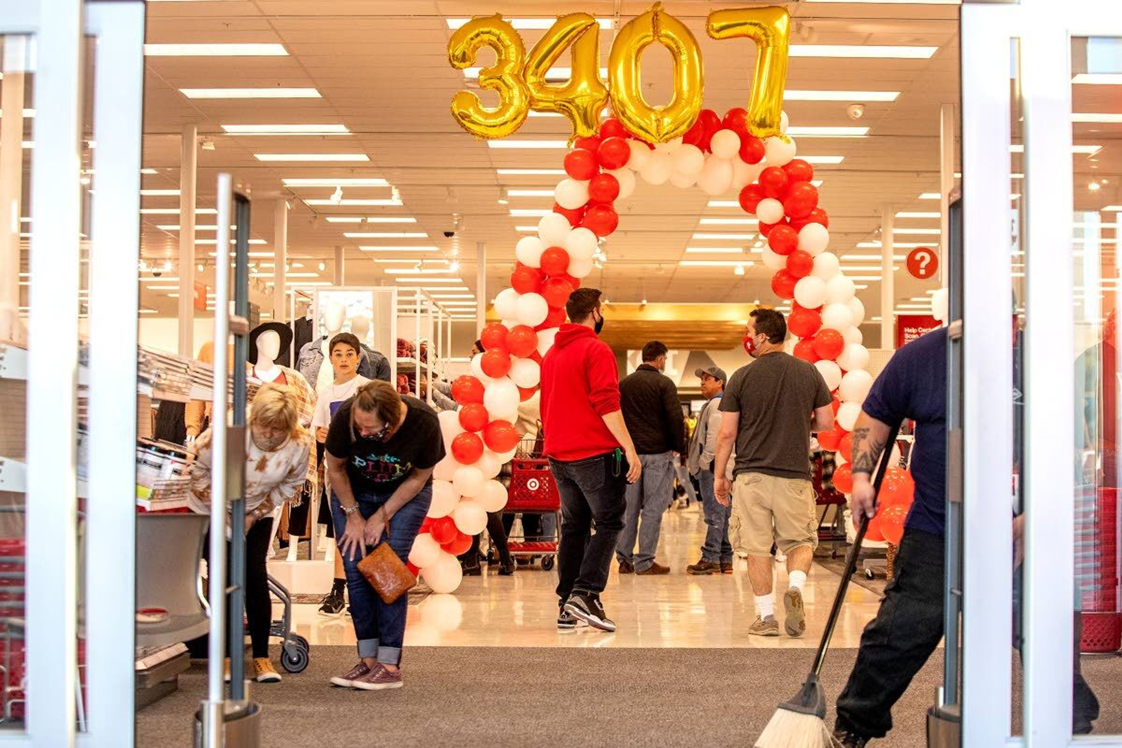 People move about through the new Target as it opens to the public on Tuesday in Moscow.