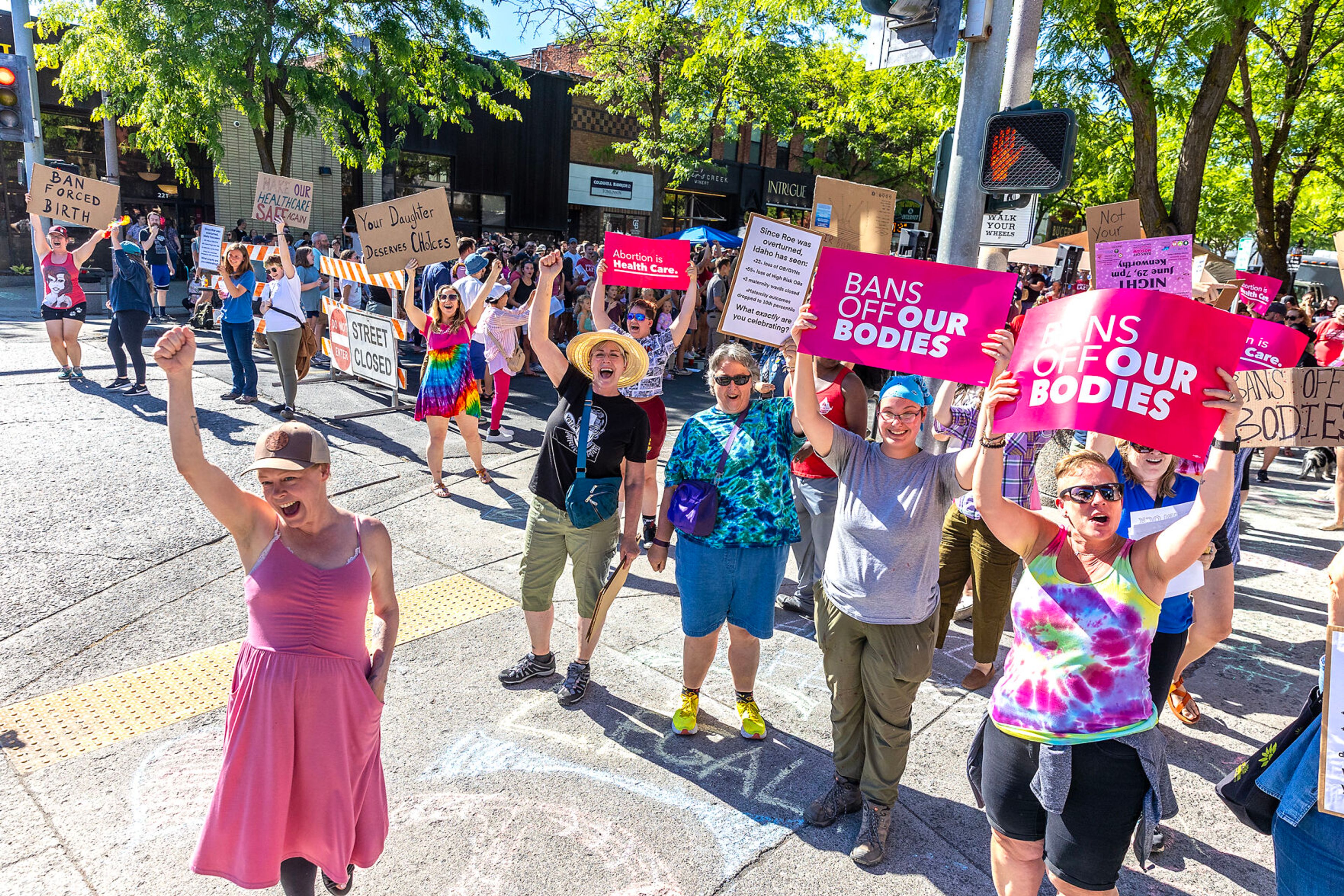 Counter protesters cheer as a semi truck honks its horn during a block party celebrating the anniversary of the overturning of Roe v. Wade on Main Street Monday in Moscow.