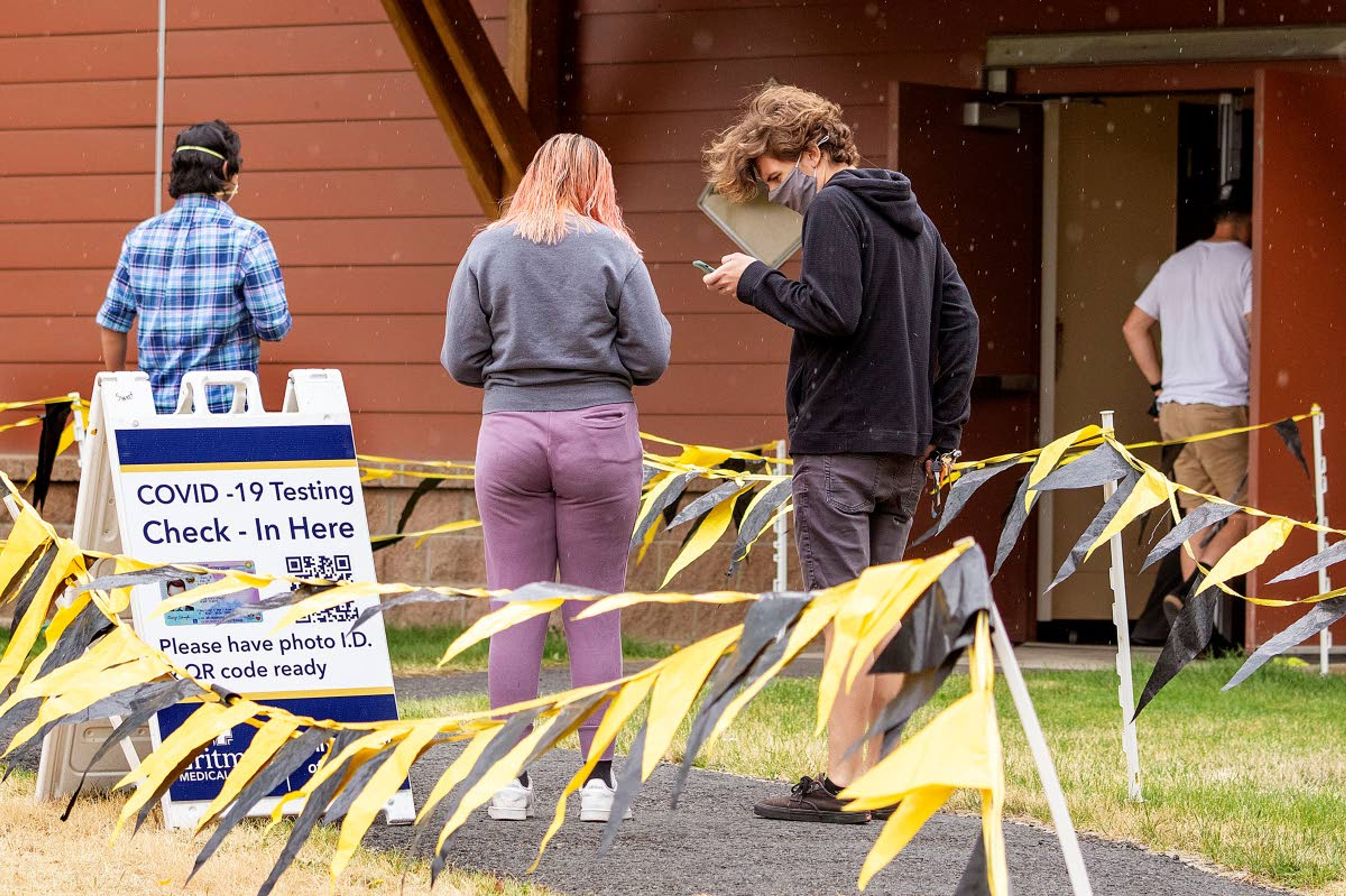 University of Idaho students line up for COVID-19 tests Wednesday outside the Student Recreation Center in Moscow. The university’s plans to open its own lab to process the tests has been delayed, but school official say it should be ready soon.