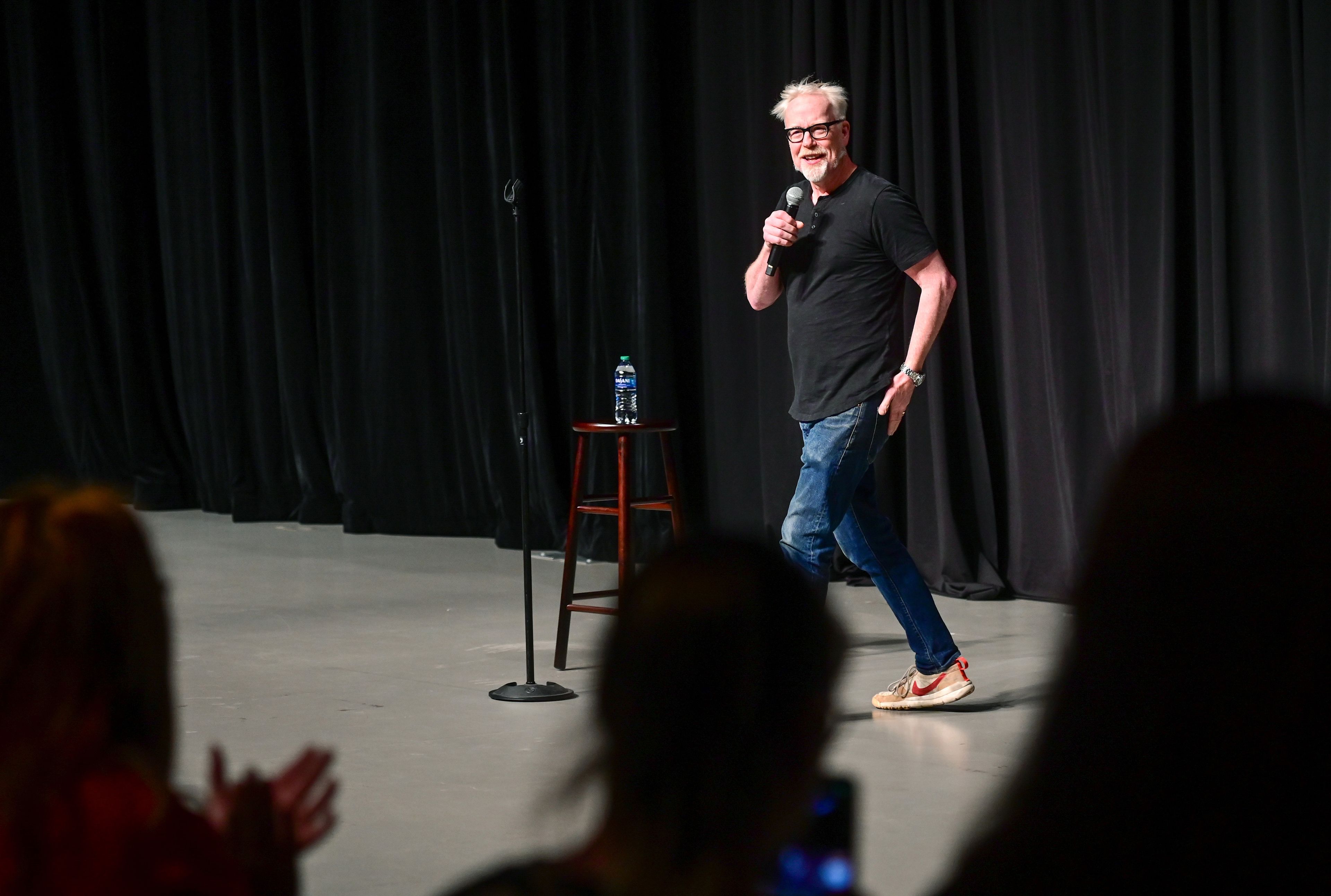 Adam Savage enters Beasley Coliseum to applause at an Earth Day event in Pullman on Sunday. The former co-host of "MythBusters" gave a keynote on his work and responded to crowd questions.