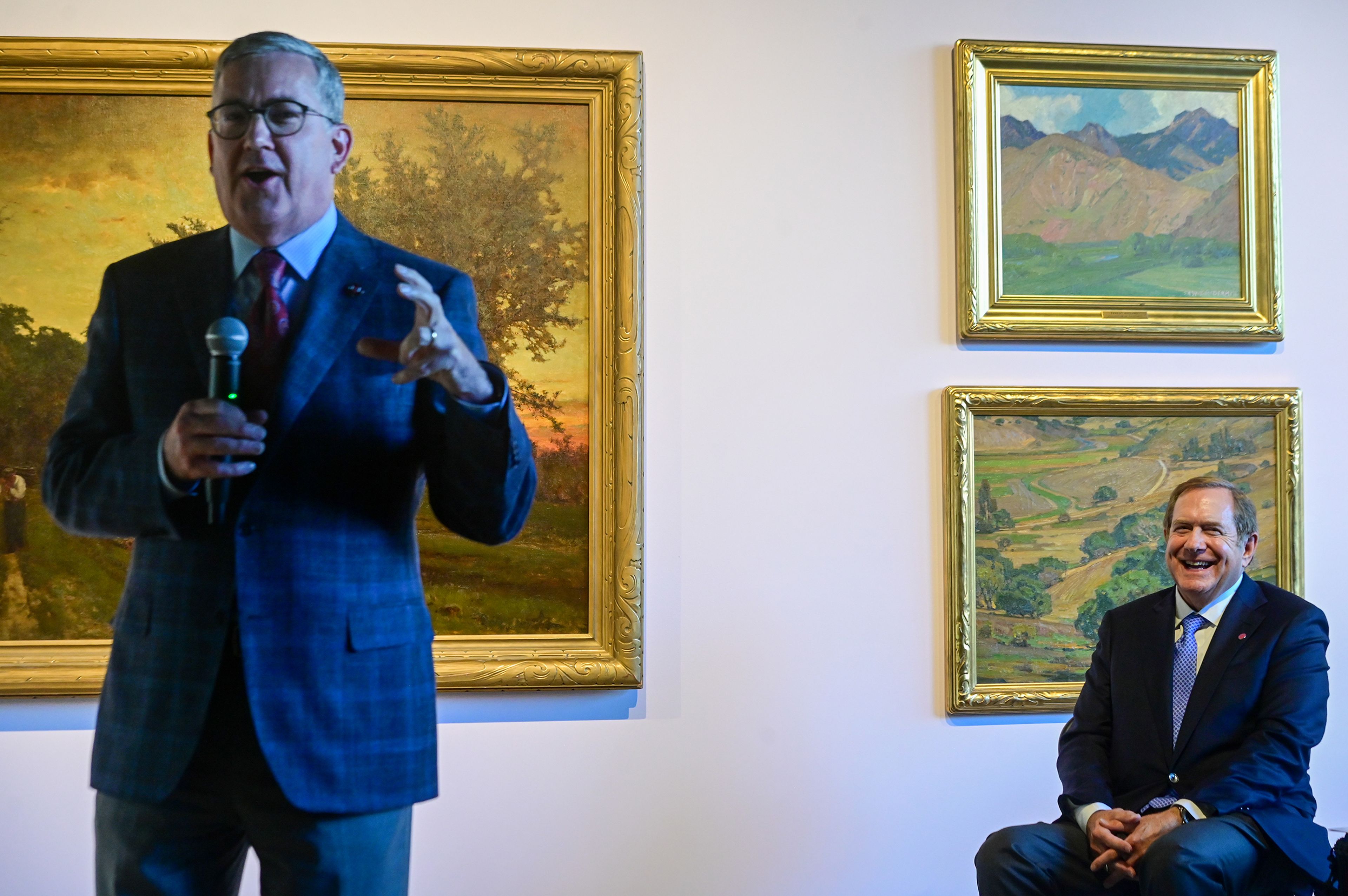 Washington State University President Kirk Schulz shares a story about Jordan Schnitzer, right, founder of the Jordan Schnitzer Family Foundation, during a reception and book release to celebrate 50 years since the art museums inception Thursday at the Jordan Schnitzer Museum of Art at WSU in Pullman.,