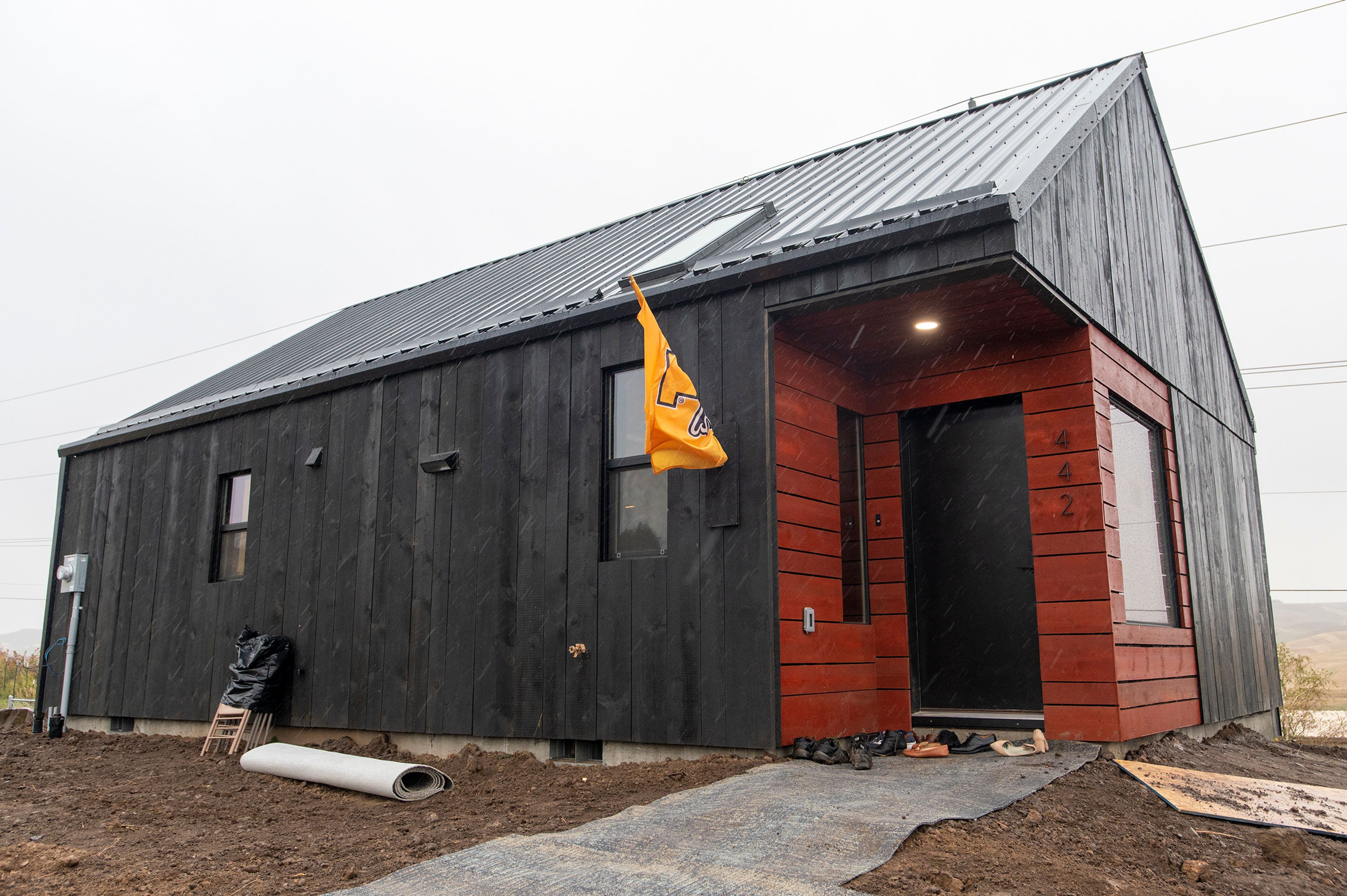 Raindrops fall onto a newly built home by members of Moscow Affordable Housing Trust and the University of Idaho in Moscow on Friday.