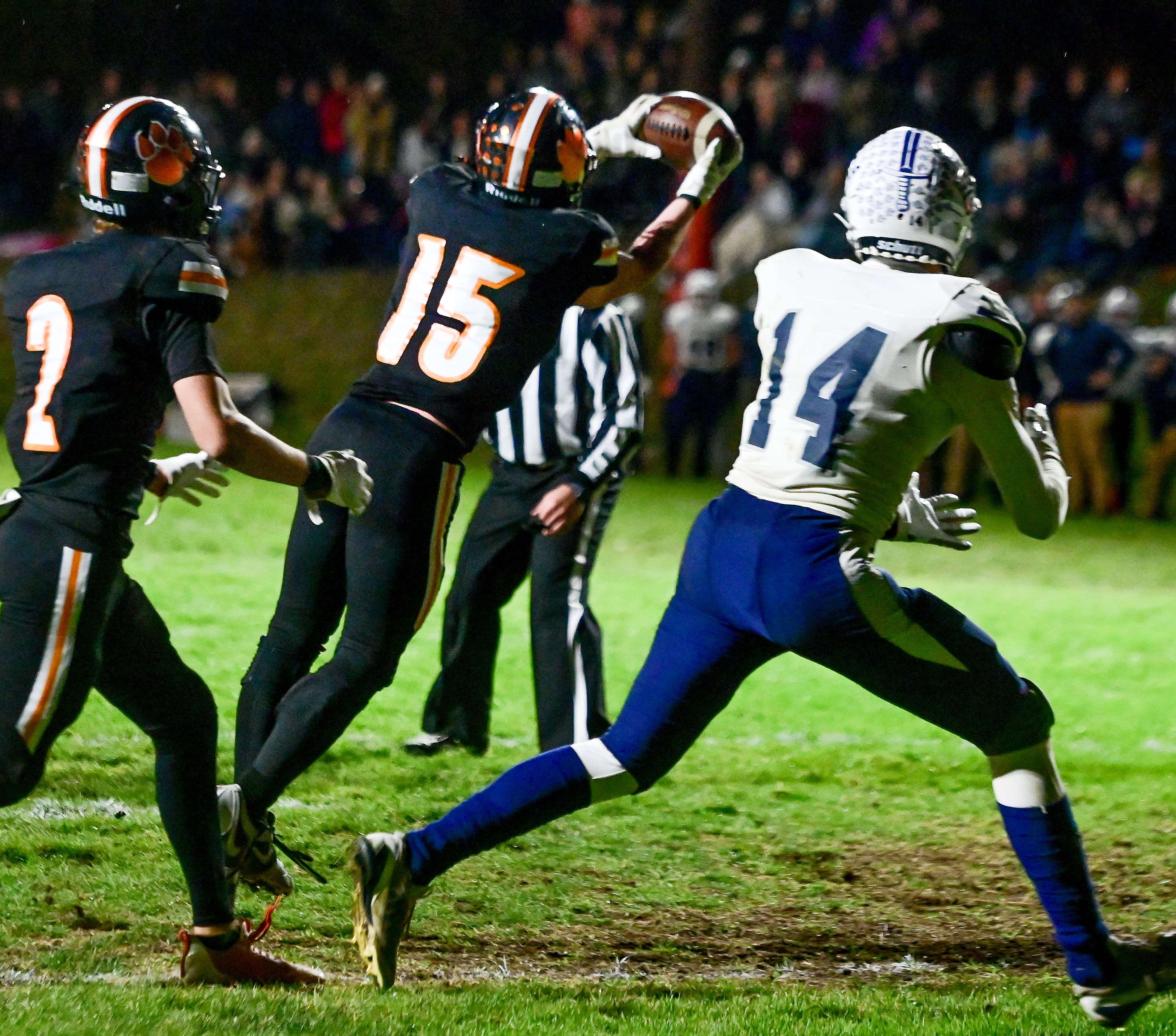 Kendrick�s Xavier Carpenter intercepts a pass intended for Logos� Lucius Comis Friday in Kendrick.,