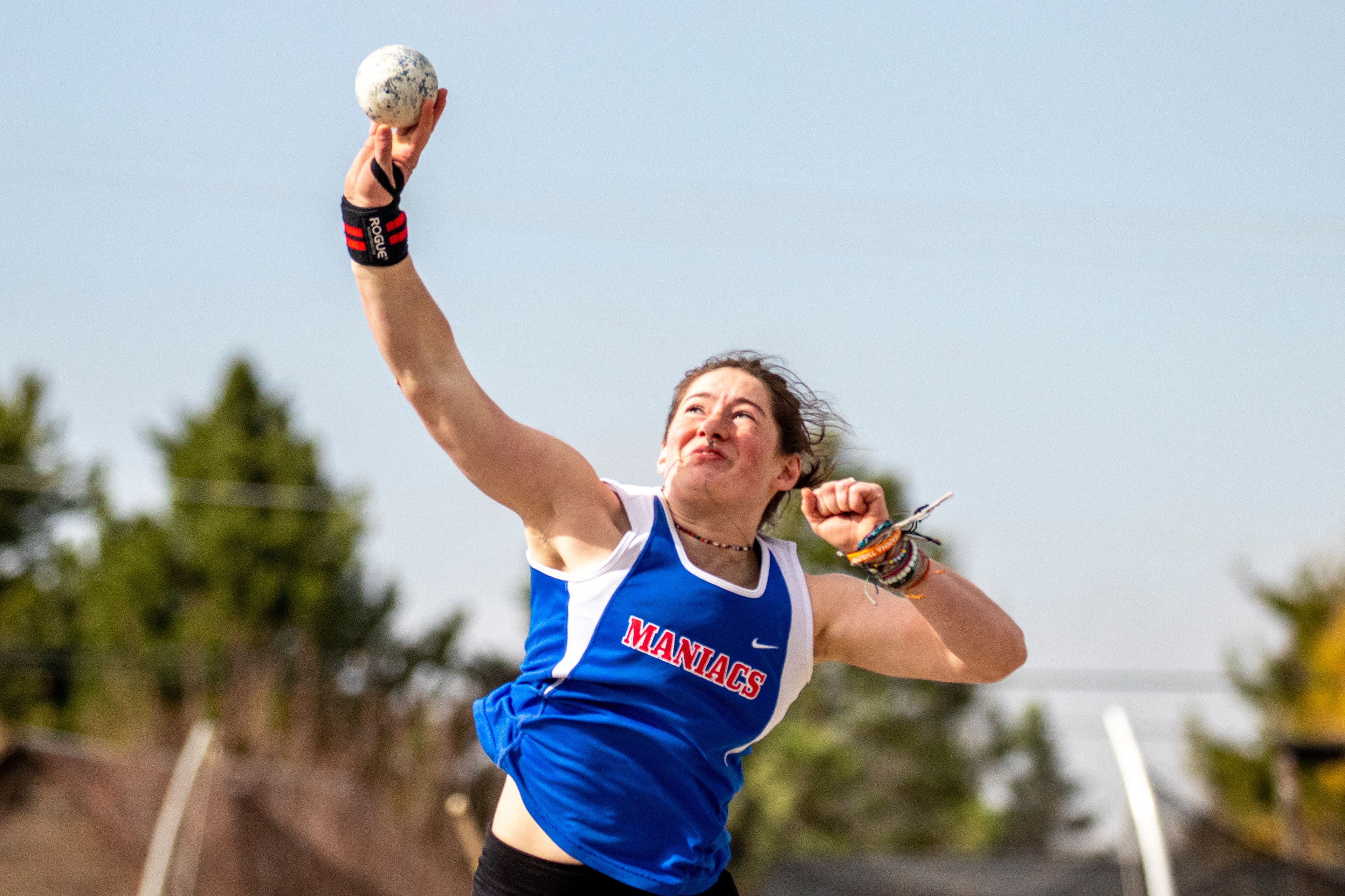 Orofino High School senior Ruby Kessinger shows she’s a maniac with muscle Friday during the shot put event at the Moscow Track Invitational.