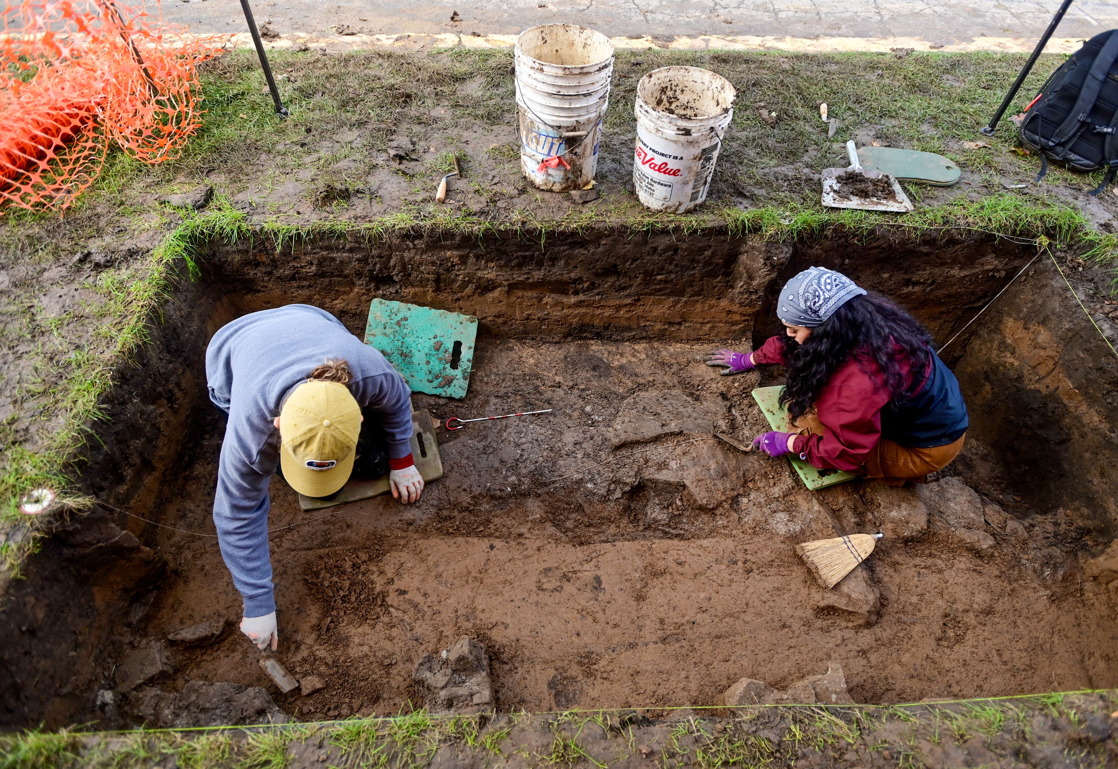 Sophie Streisand, left, an undergraduate student at the University of Idaho, and Nicole Rojas, a graduate student at UI, work to clear part of the entrance to Moscow’s original high school as part of an excavation project at Moscow High School on Tuesday.