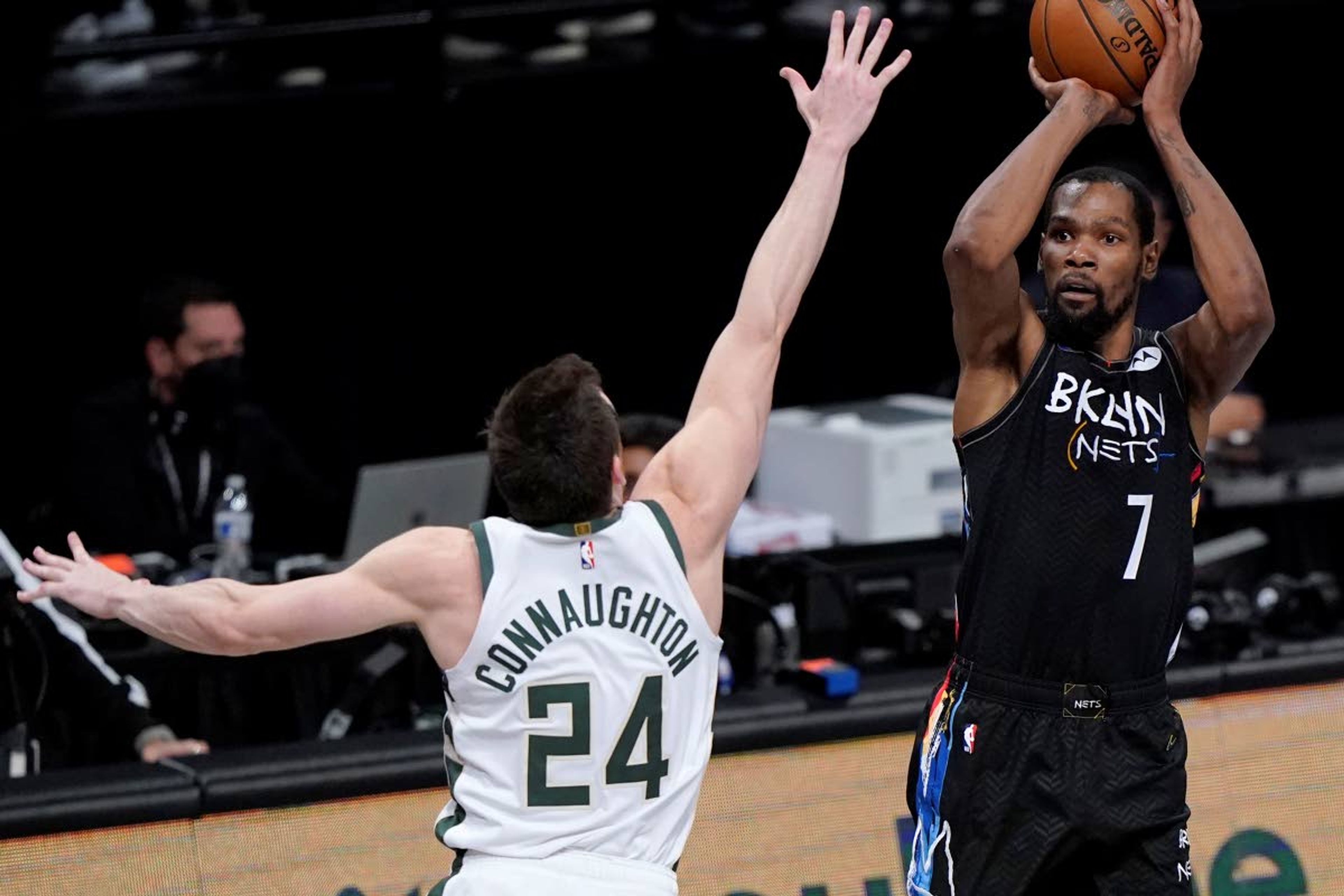 Nets star Kevin Durant shoots as the Bucks’ Pat Connaughton defends in the fourth quarter of a second-round playoff game Tuesday in New York.