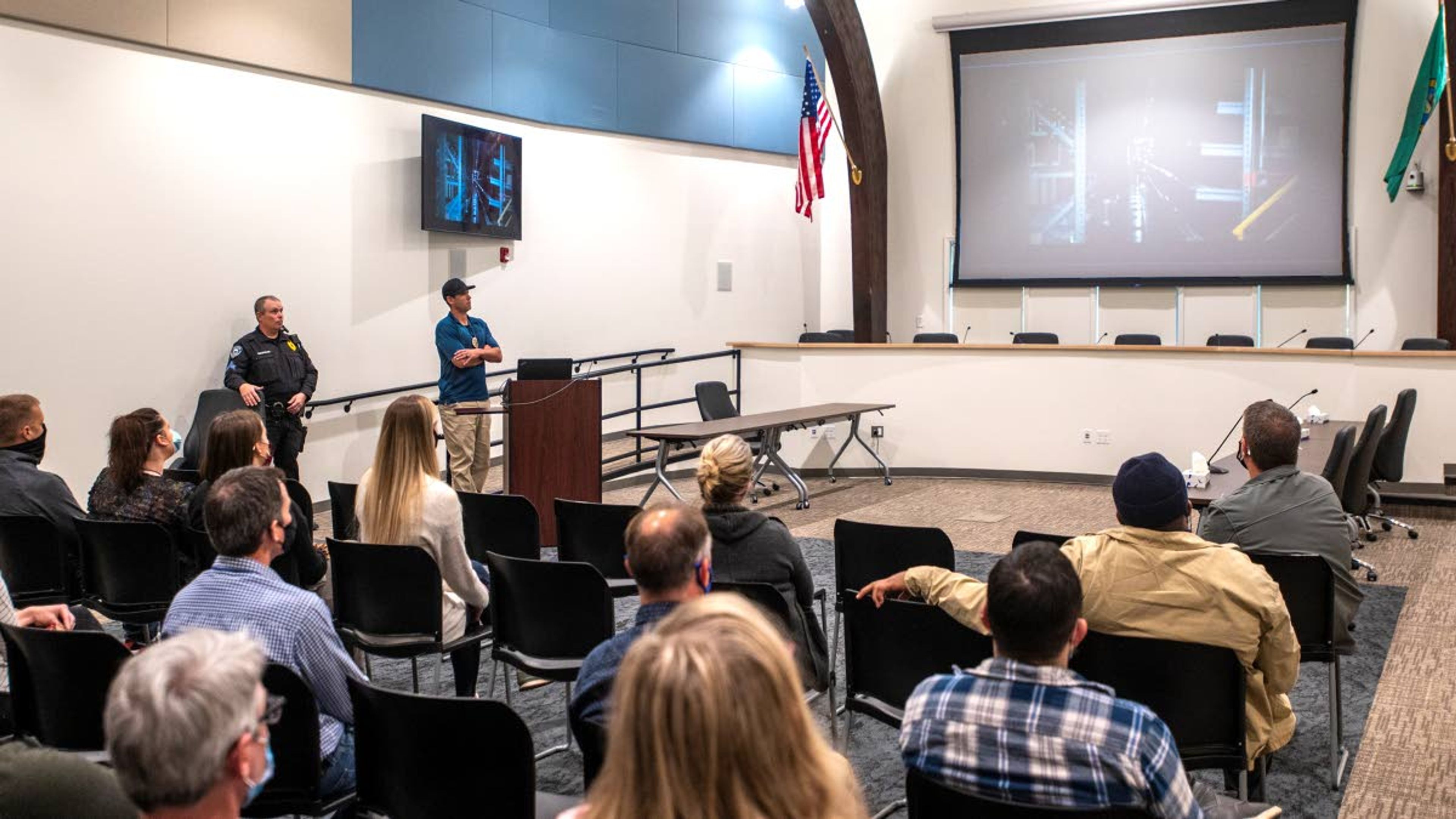 Sergeant Aaron Breshears, left, and detective Josh Bray, middle, of the Pullman Police Department give a presentation on active shooter training to city employees at Pullman City Hall on Wednesday afternoon.