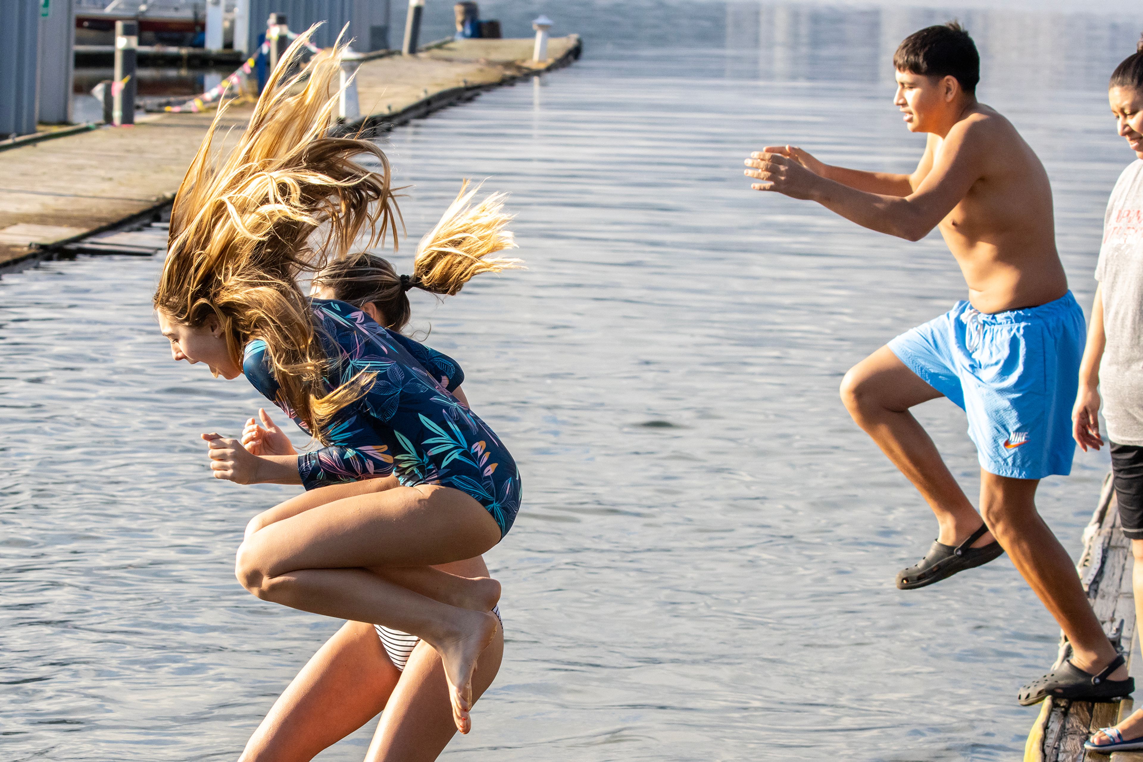 Hair flies as people leap into the Snake River for the Polar Plunge Monday in Clarkston.