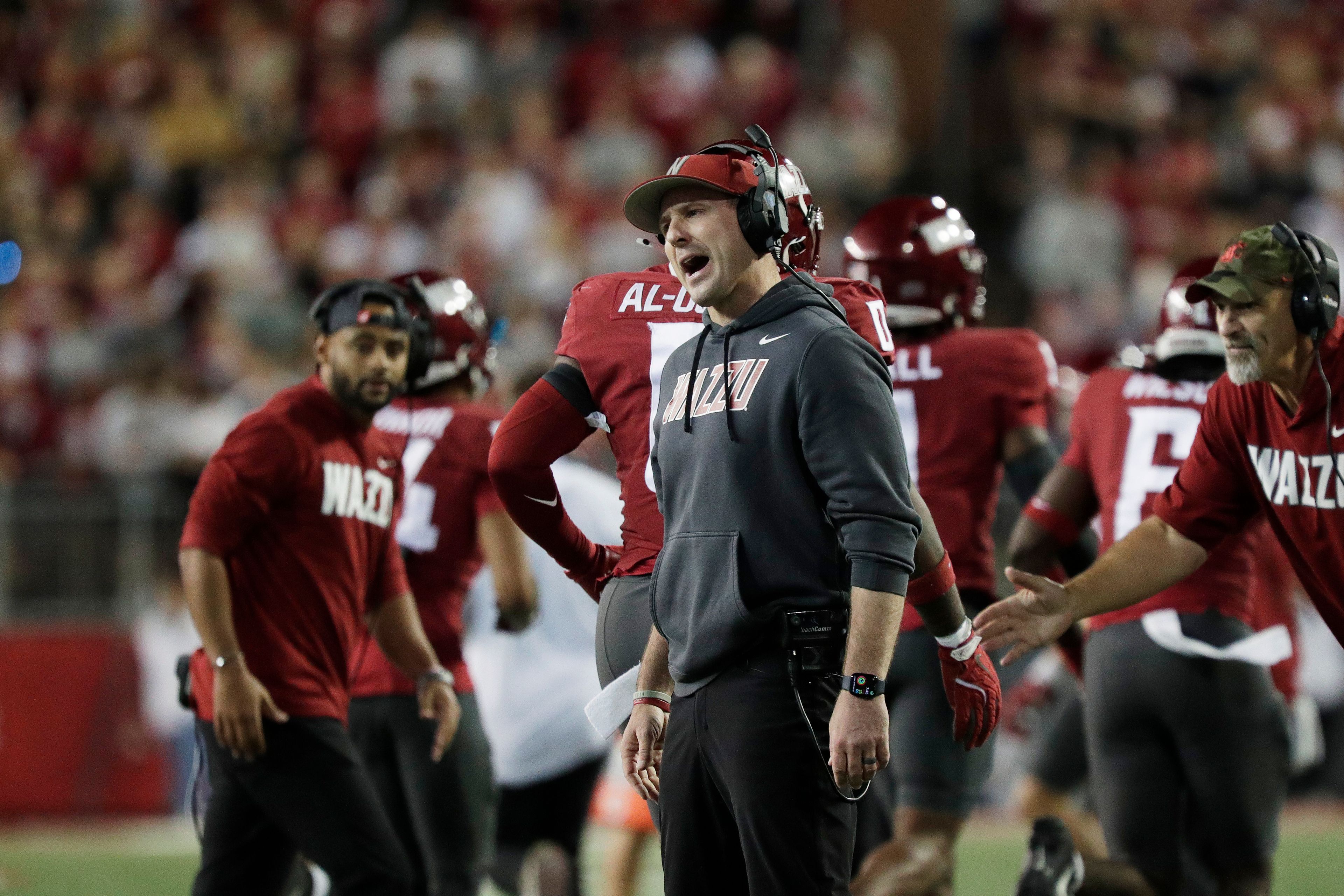 Washington State head coach Jake Dickert, center, reacts during the first half of an NCAA college football game against San Jose State, Friday, Sept. 20, 2024, in Pullman, Wash. (AP Photo/Young Kwak)