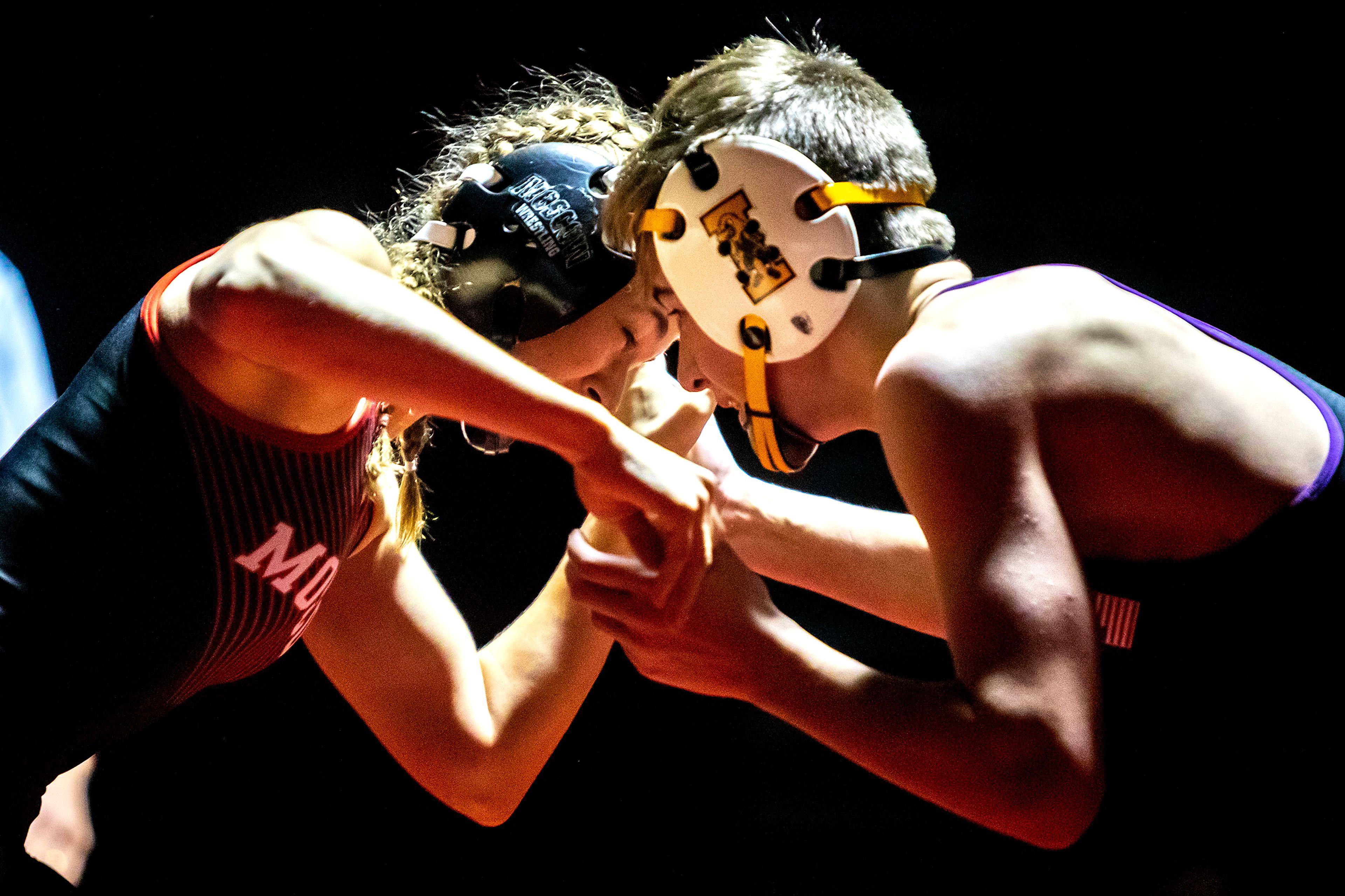 Moscow’s Skyla Zimmerman wrestles with Lewiston’s Jase Hendren in Moscow at a wrestling dual on Saturday, Dec. 11, 2021.