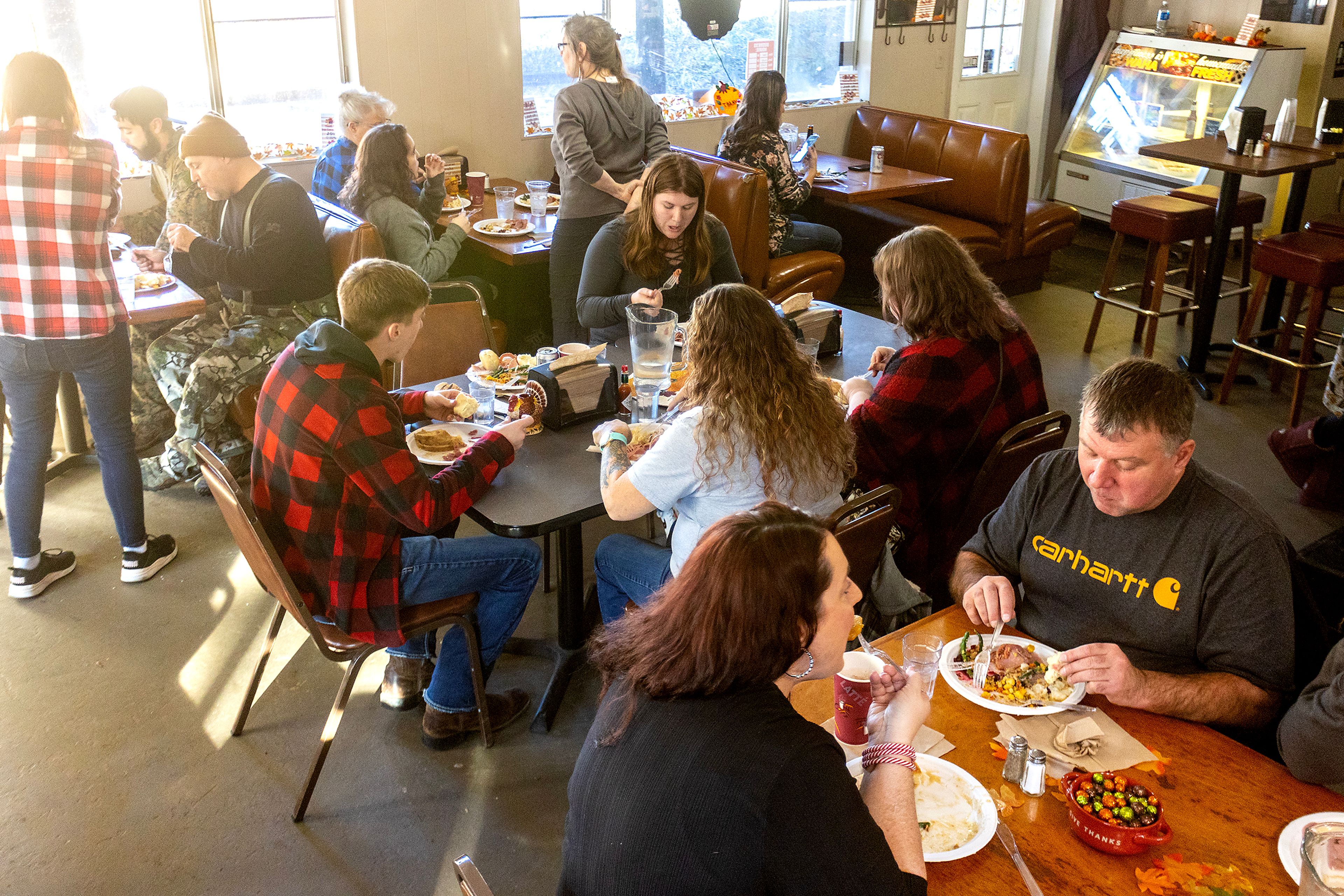 People eat a Thanksgiving meal at the Waha Grill on Thursday.