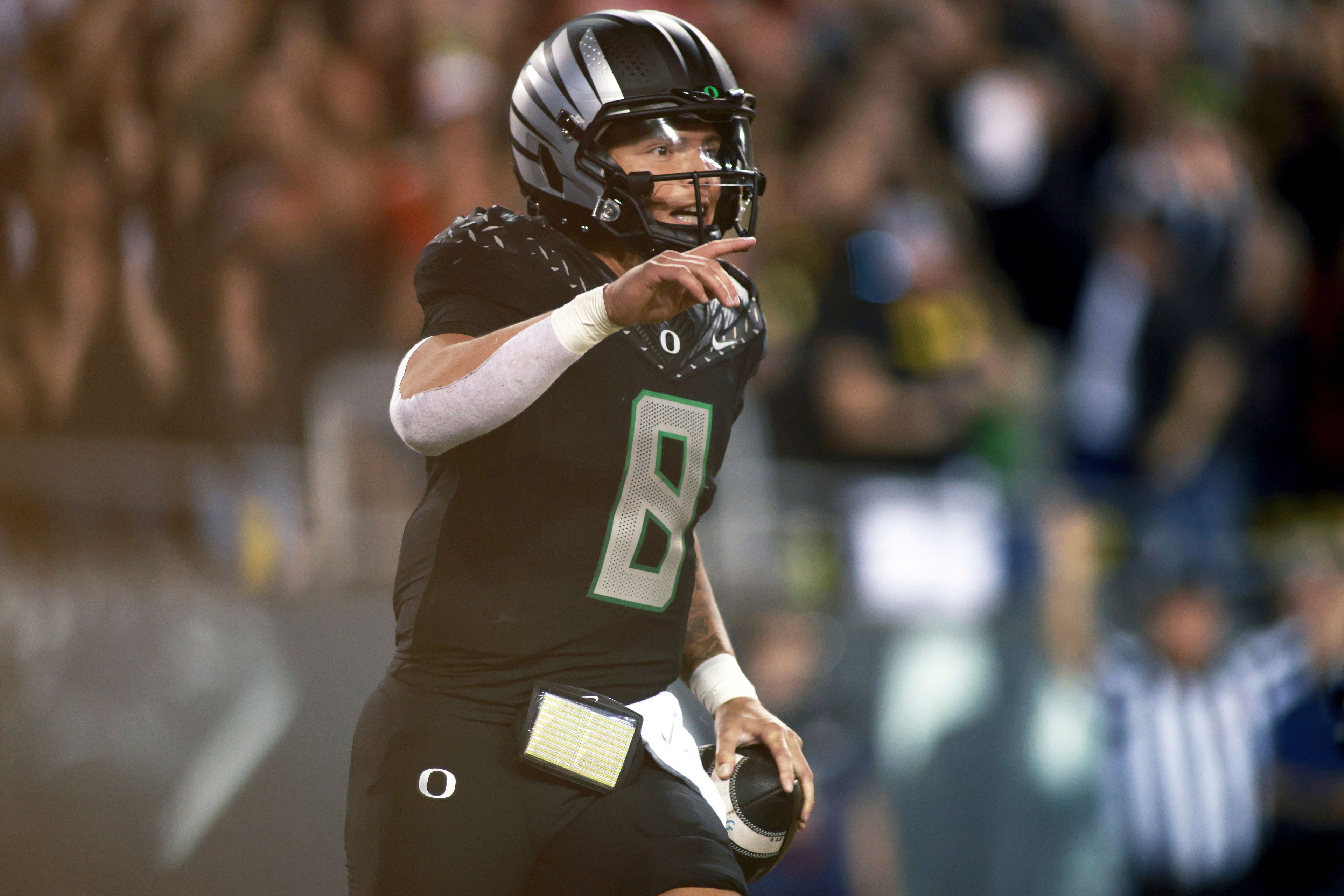 Oregon quarterback Dillon Gabriel (8) celebrates his touchdown during an NCAA college football game against Ohio State, Saturday, Oct. 12, 2024, in Eugene, Ore. (AP Photo/Lydia Ely)