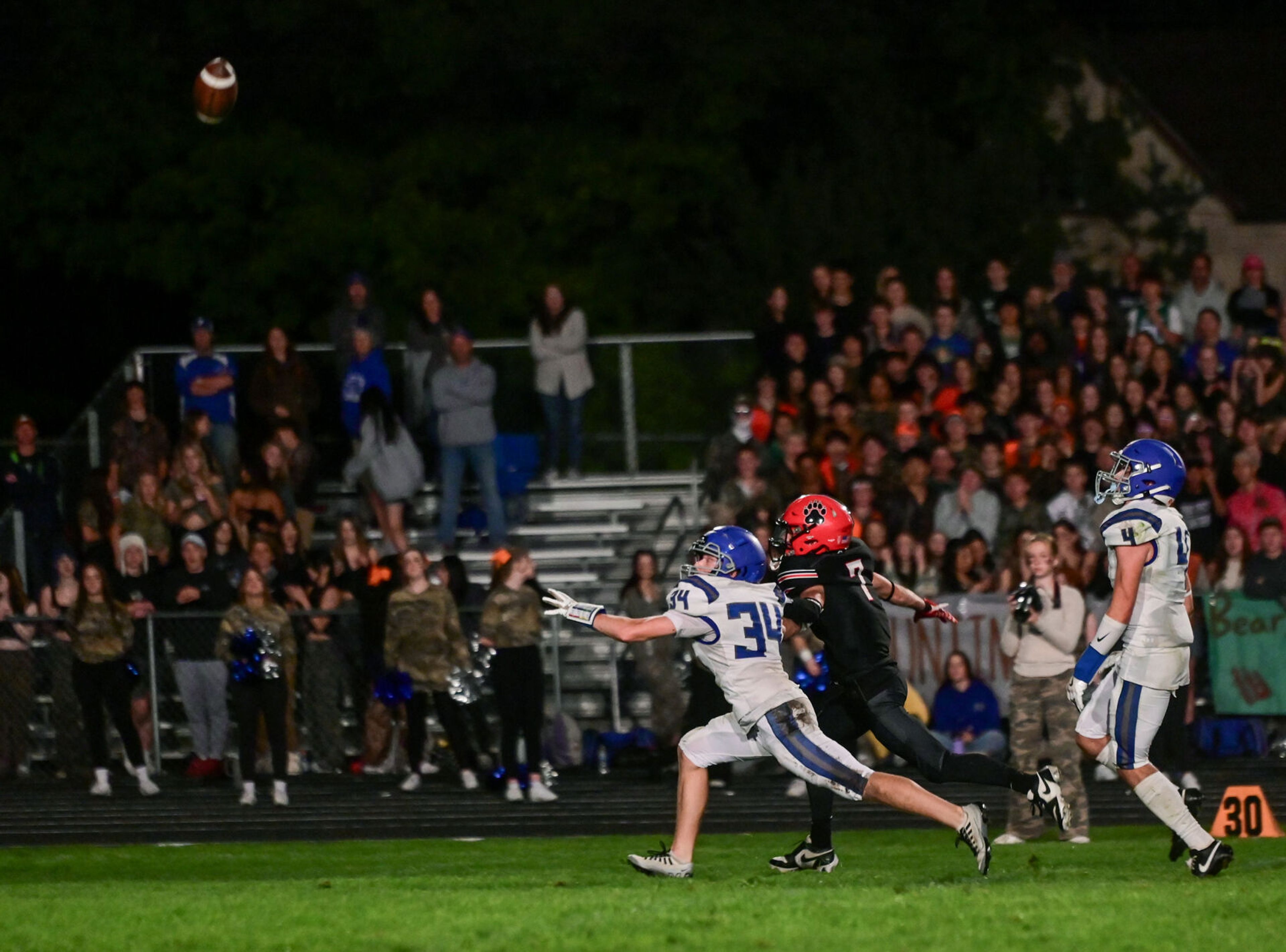 Moscow running back Keaton Frei chases after a Bears pass with pressure from Pullman defense Friday in Moscow.