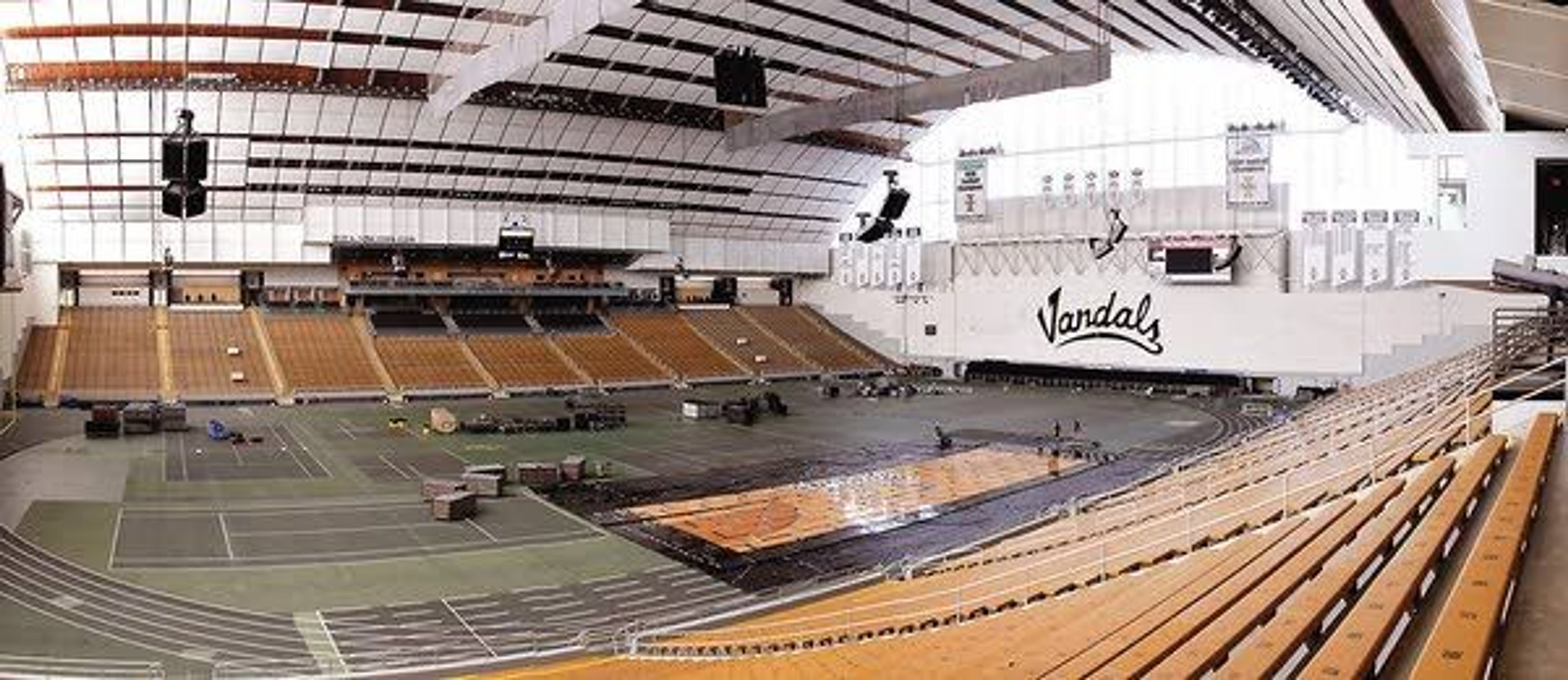 University of Idaho employees disassemble a basketball court in the ASUI-Kibbie Activity Center in Moscow on Wednesday. The roof was built on the building 40 years ago.