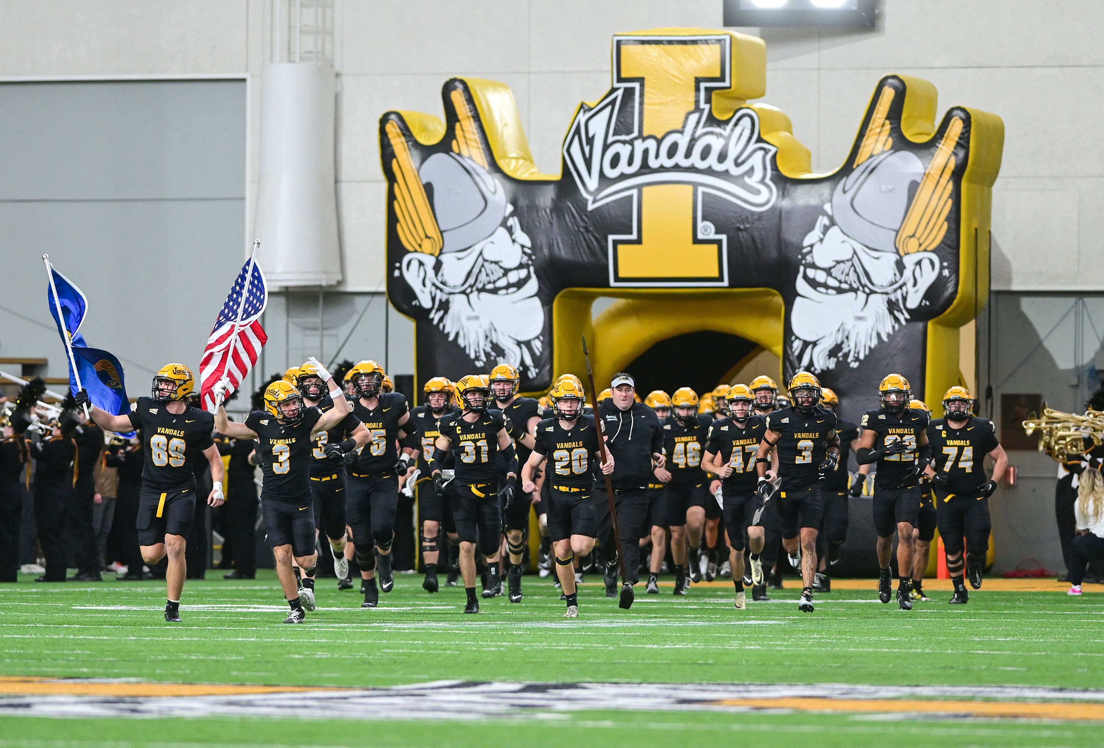 Idaho enters the field Saturday before a game against Cal Poly at the P1FCU Kibbie Dome in Moscow.,