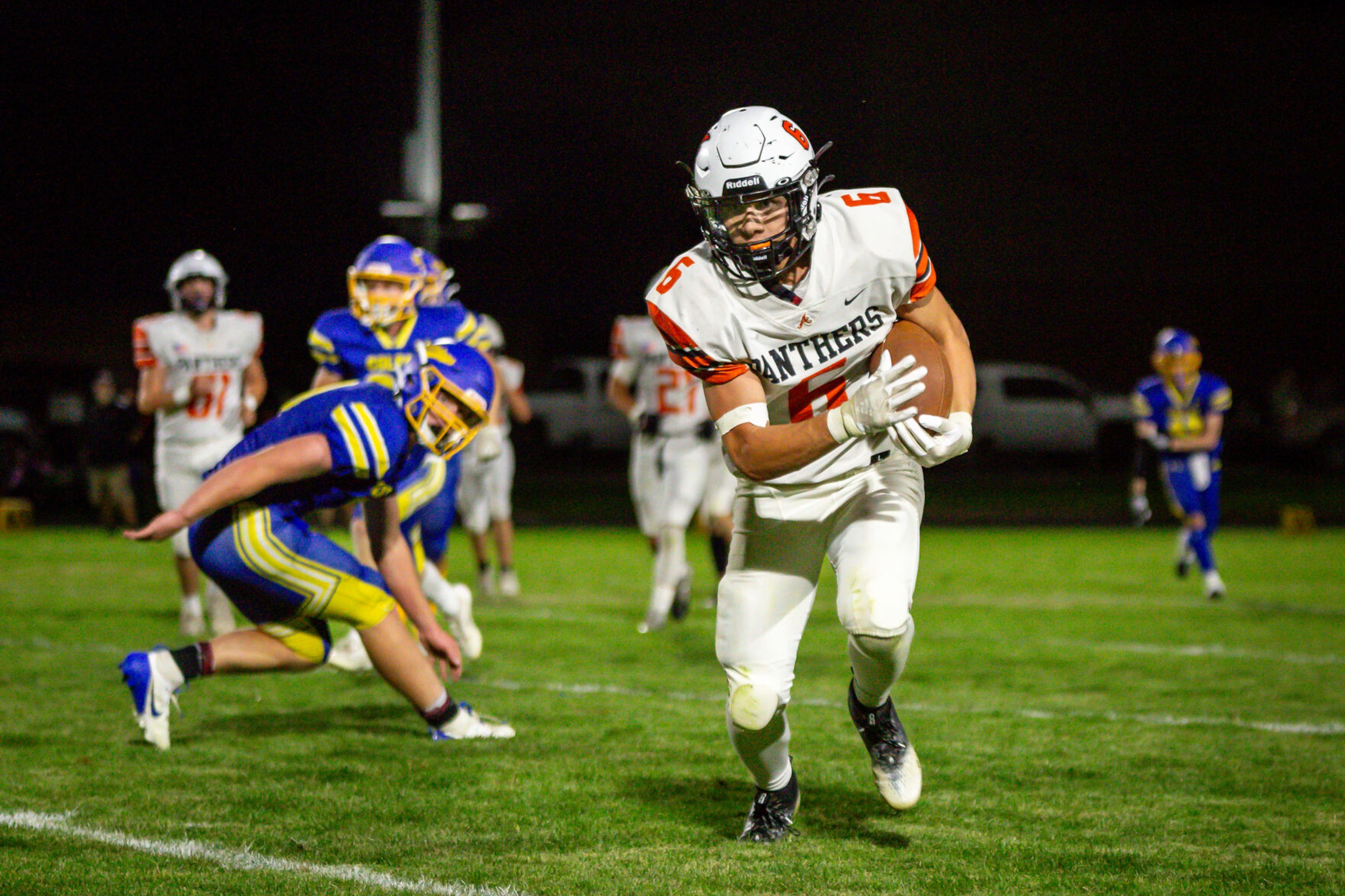 Asotin senior running back Peter Eggleston avoids a tackle during a game against Colfax on Friday, Sept. 20, in Colfax.