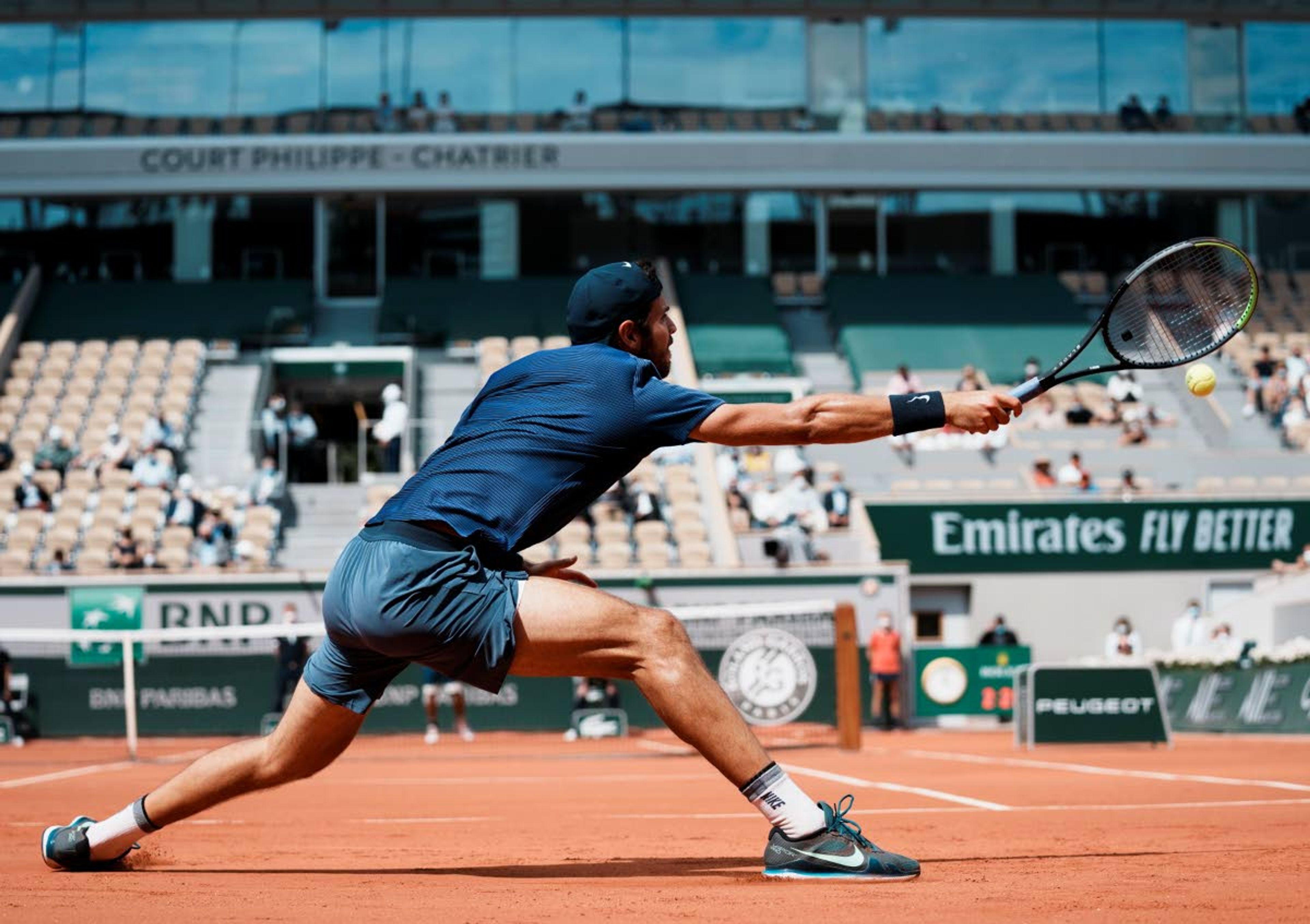 Russia's Karen Khachanov plays a return to Japan's Kei Nishikori during their second round match on day four of the French Open tennis tournament at Roland Garros in Paris, France, Wednesday, June 2, 2021. (AP Photo/Thibault Camus)