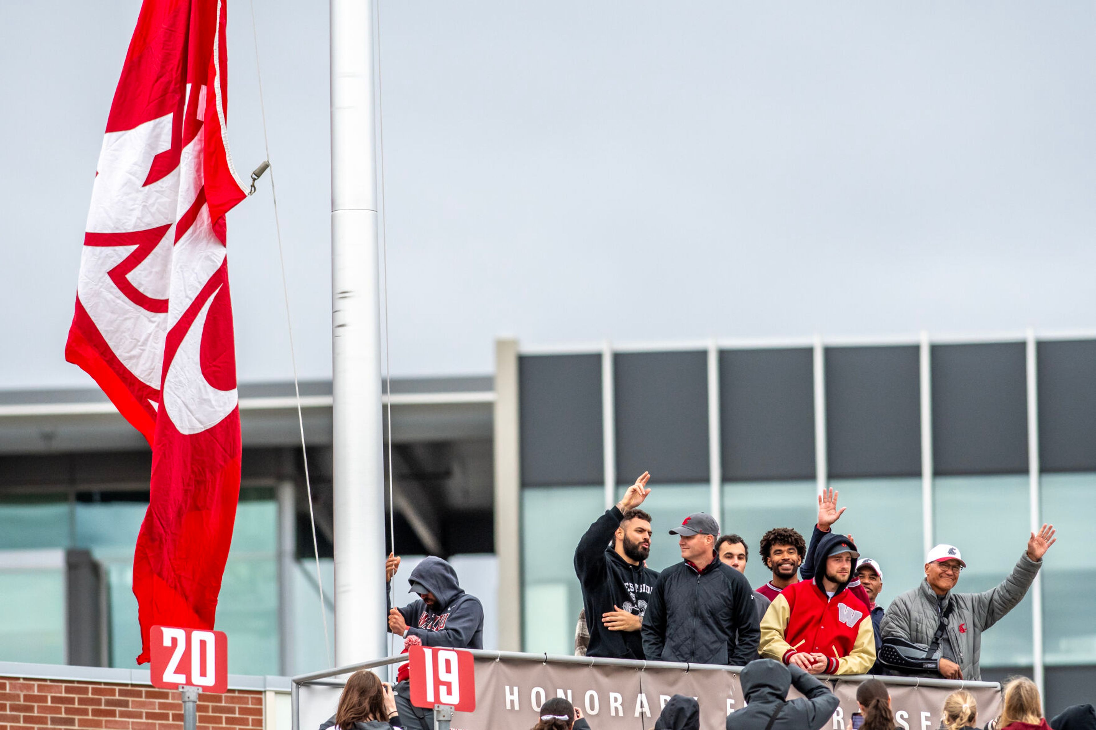 Formers Cougars raise the flag before the start of the Crimson and Gray Game at Washington State University in Pullman.