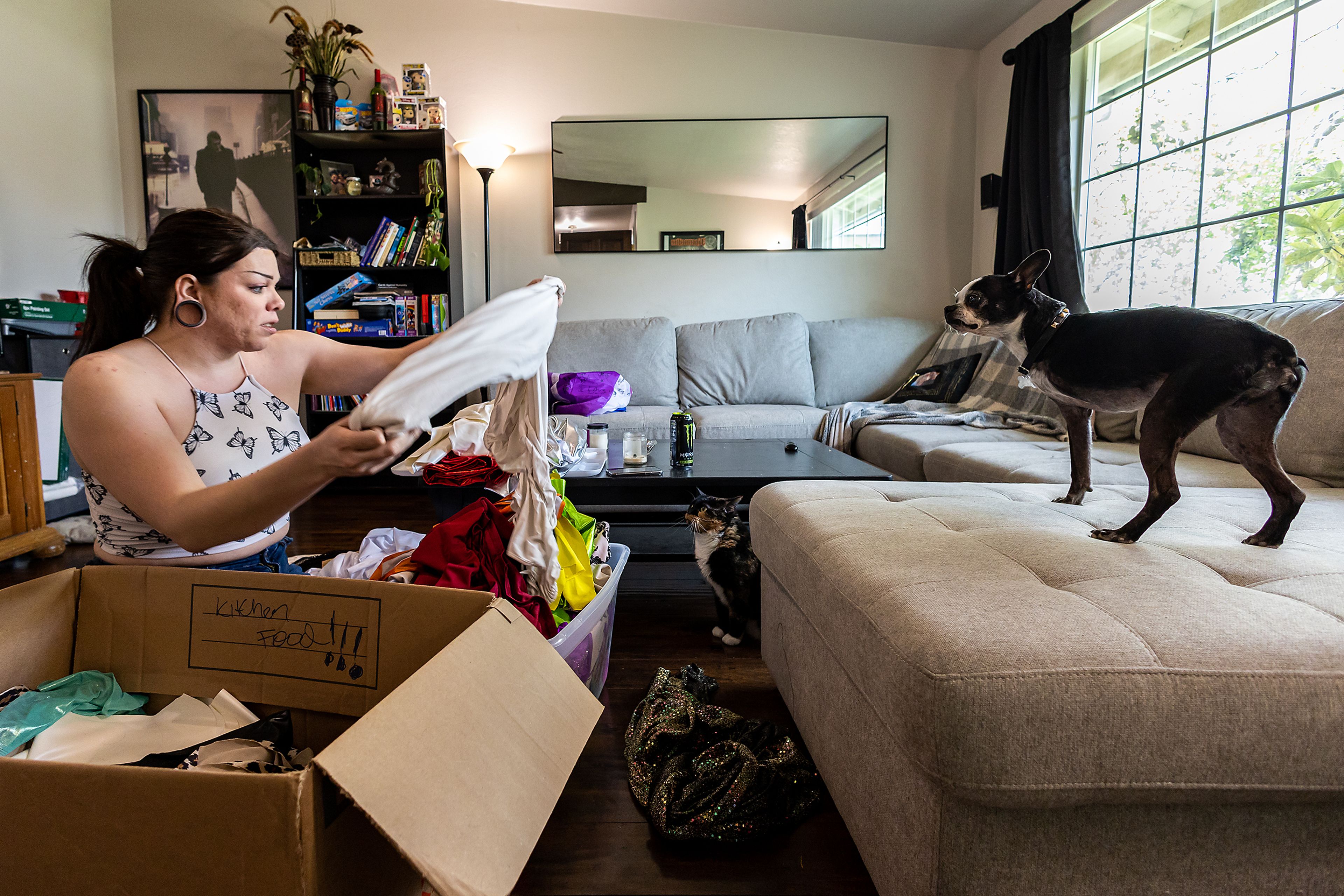 Wabaunsee begins putting together her drag outfits alongside her pets March 13 at the home in Pasco, Wash. “I find this place to be the most homey place I’ve ever been,” Wabaunsee said of her current home where she lives with her boyfriend.