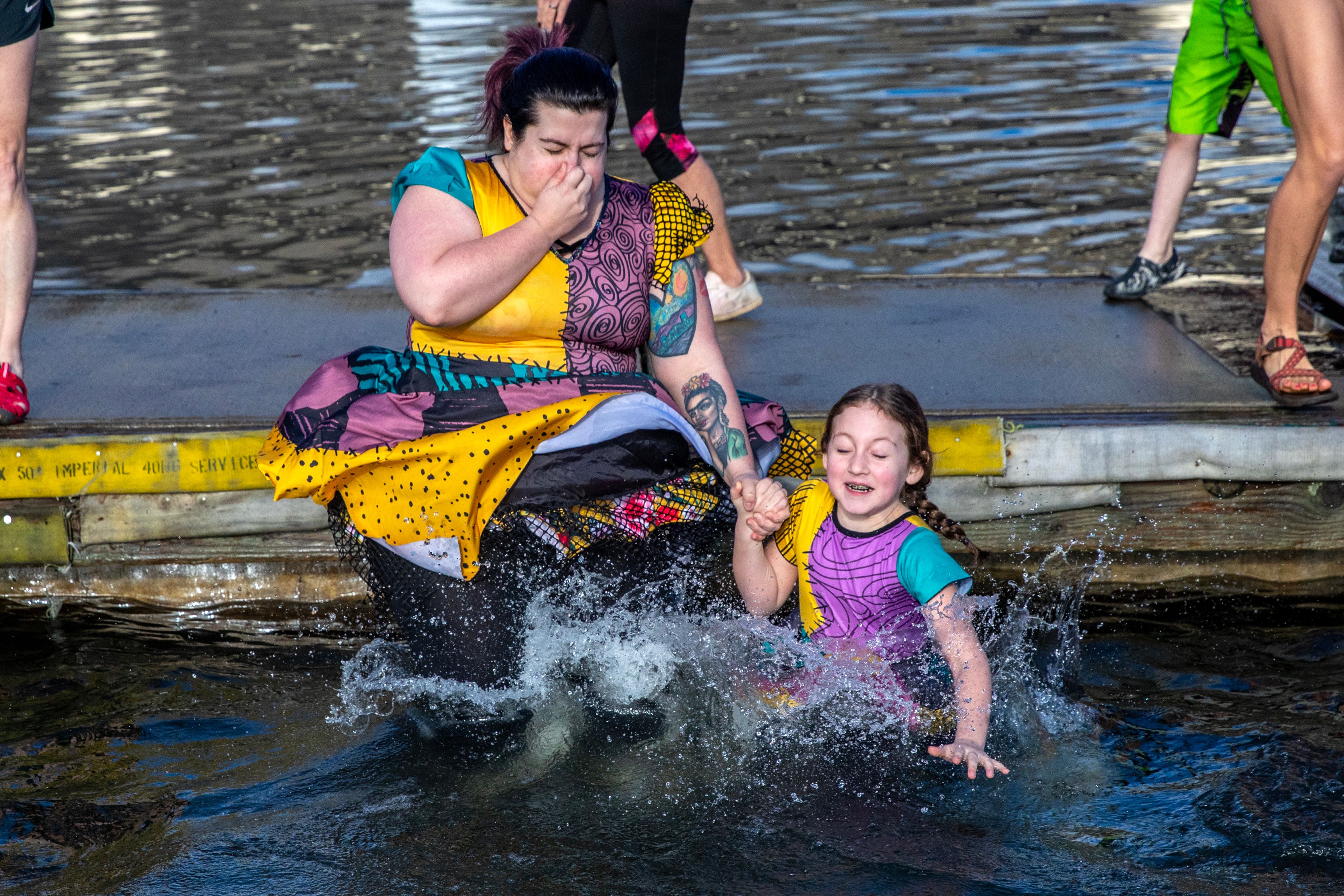 People dress to match for their jump into the Snake River at the annual Polar Plunge Monday in Clarkston.