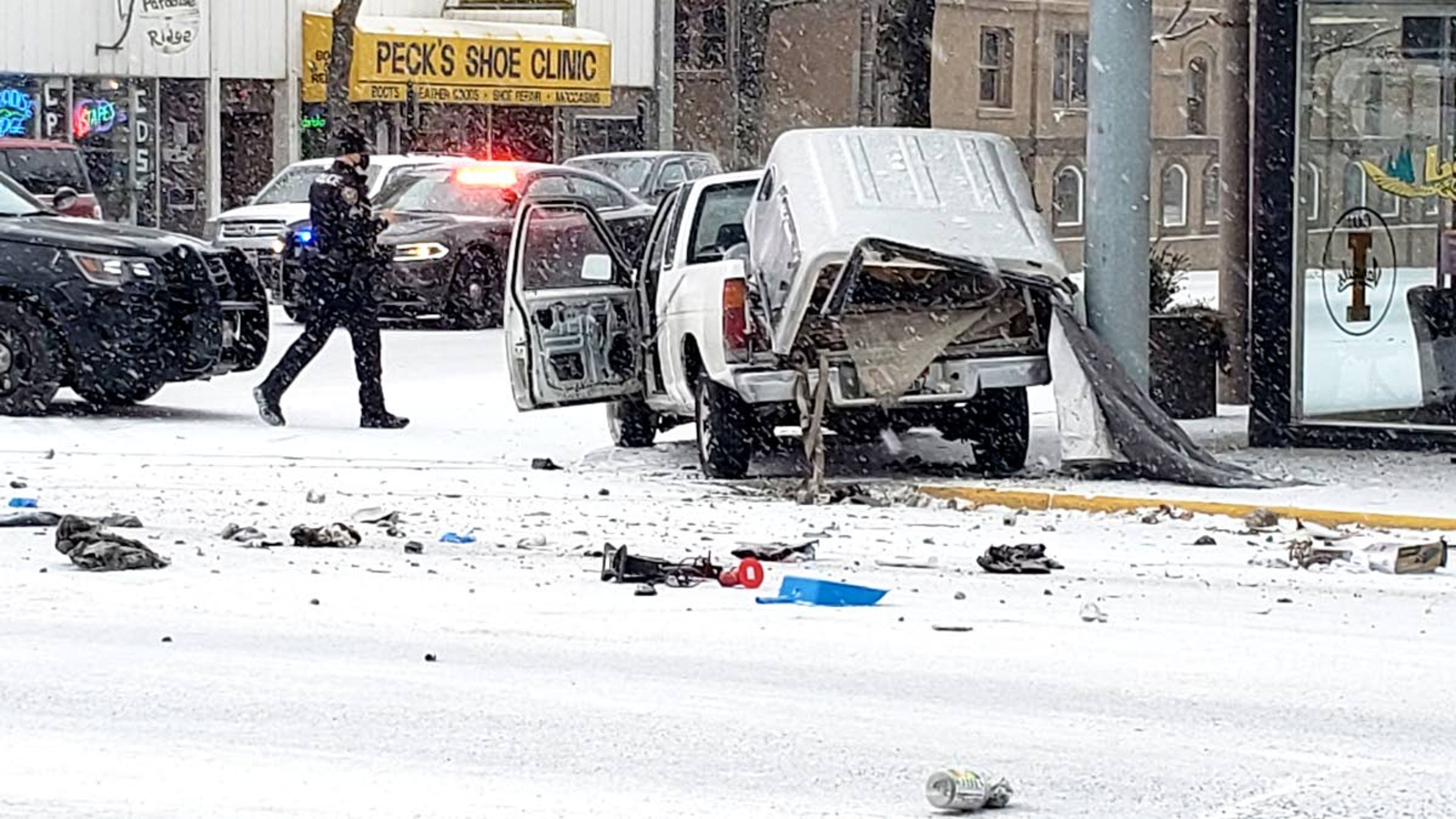 Craig Staszkow/Daily NewsA pickup truck rests on the sidewalk on the northwest corner of Washington and Third streets in Moscow on Friday morning. The truck’s driver was arrested following a short chase and multiple collisions in downtown Moscow.