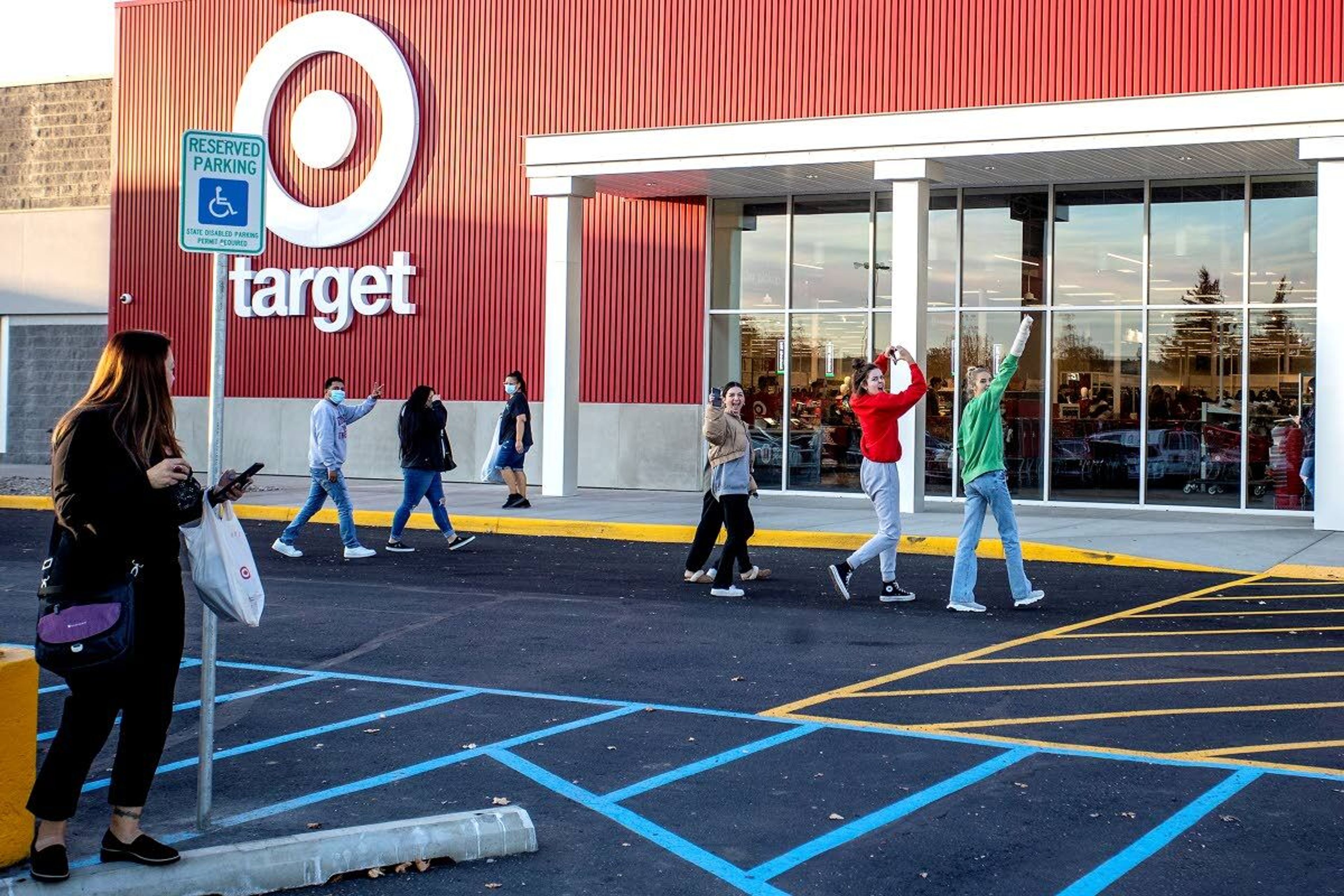 People cheer and yell “we love Target” as they head into the store.