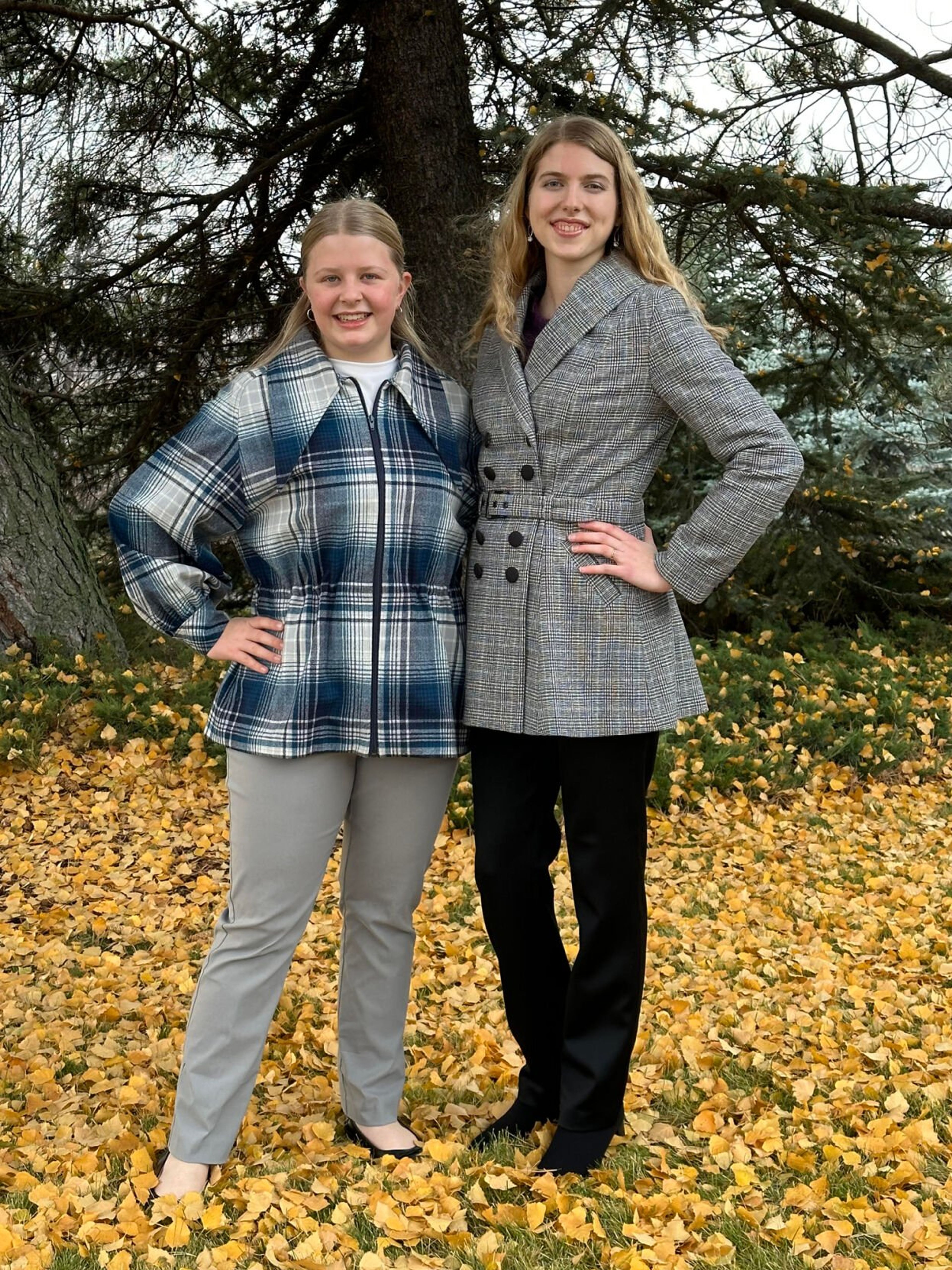 Jojo Osborn (left) and Rebekah Kasperson model their creations in wool.