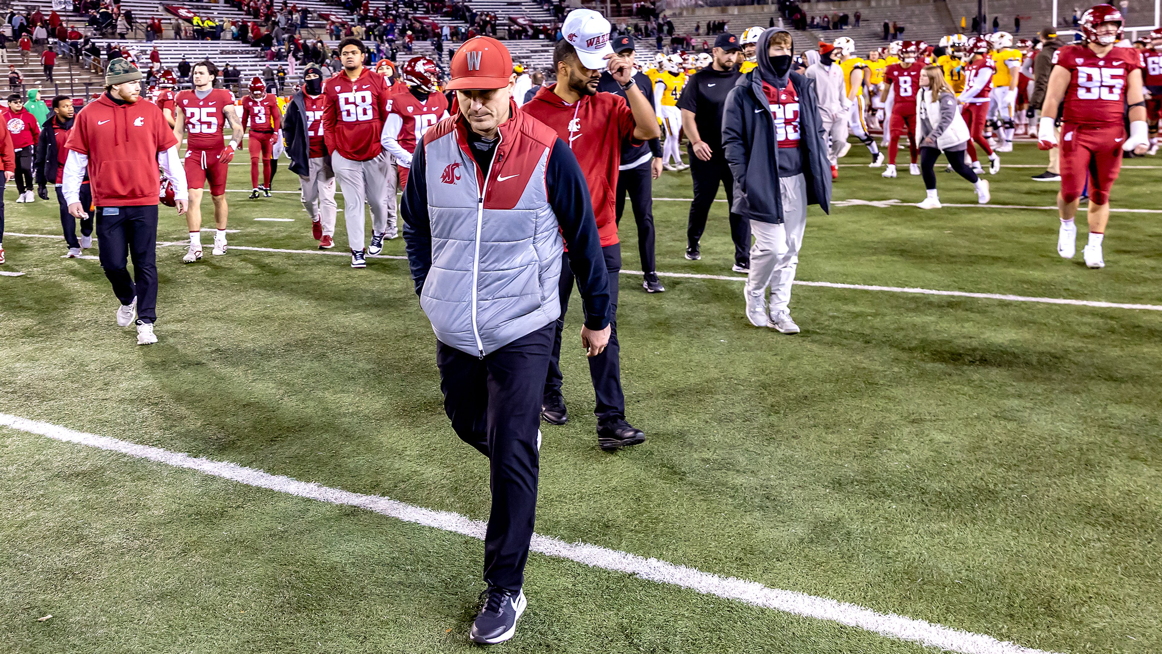 Washington State head coach Jake Dickert walks back to the locker room after being defeated by Wyoming in a college football game on Saturday, at Gesa Field in Pullman. Wyoming defeated Washington State 15-14.