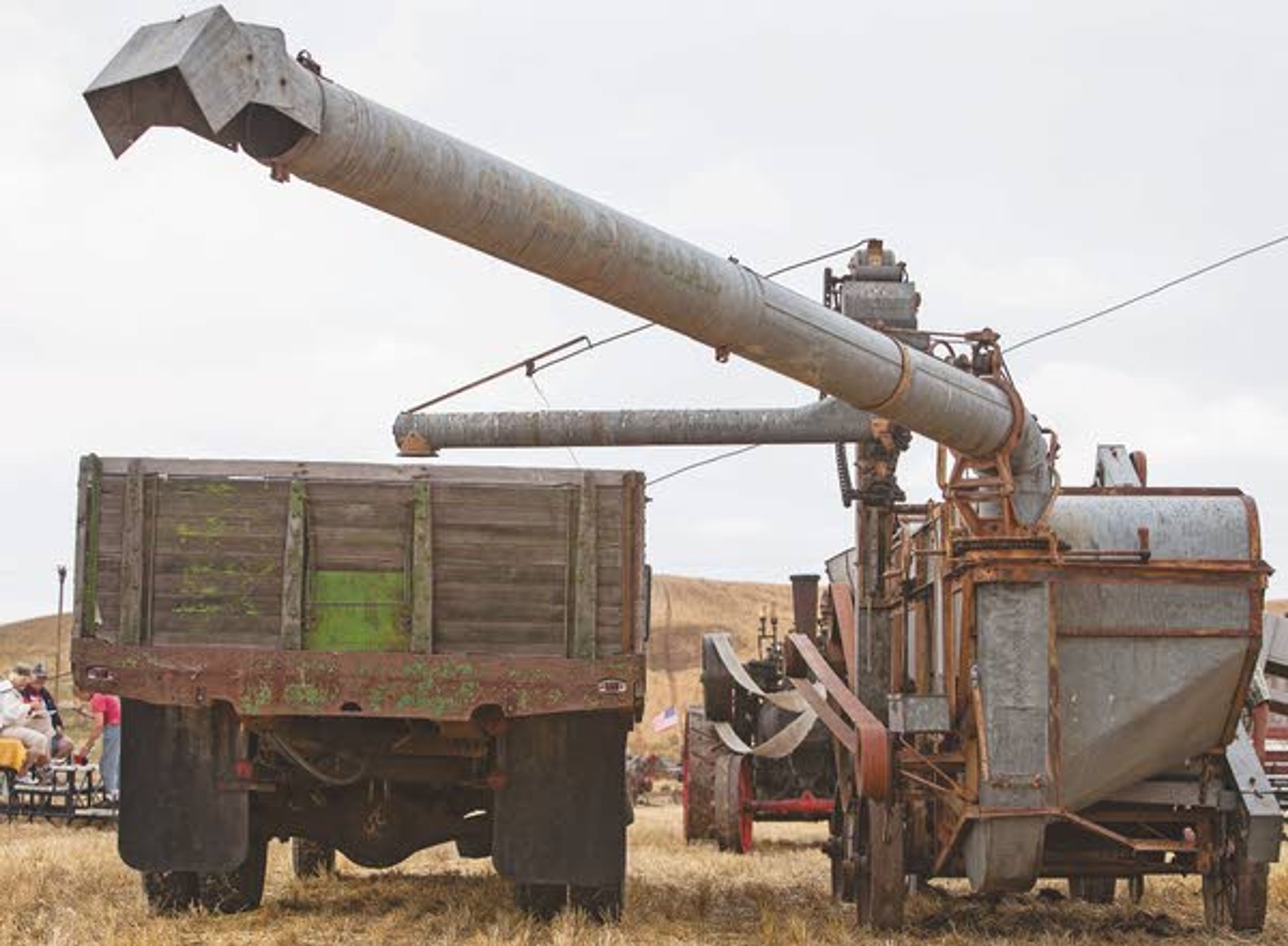 The unused threshing machine, steam engine and grain truck sit idle during the rained-out annual Palouse Empire Threshing Bee on Monday, Sept. 2, 2013, outside the Palouse Empire Fairgrounds in Colfax.