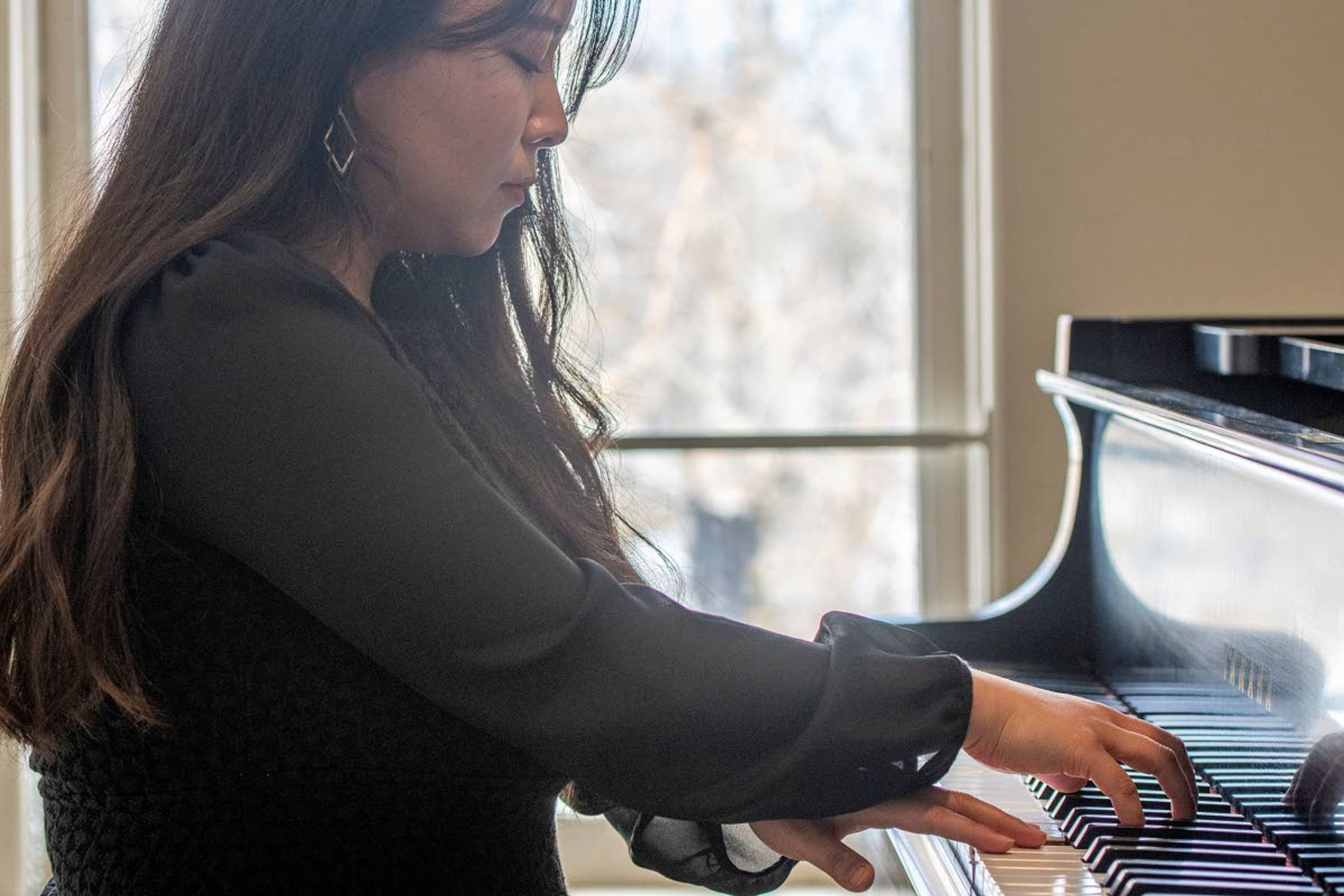 Zach Wilkinson/Daily NewsEunbee Kim second-year masters student in the piano performance program at the University of Idaho practices March 2 in a studio on the third floor of Ridenbaugh Hall.