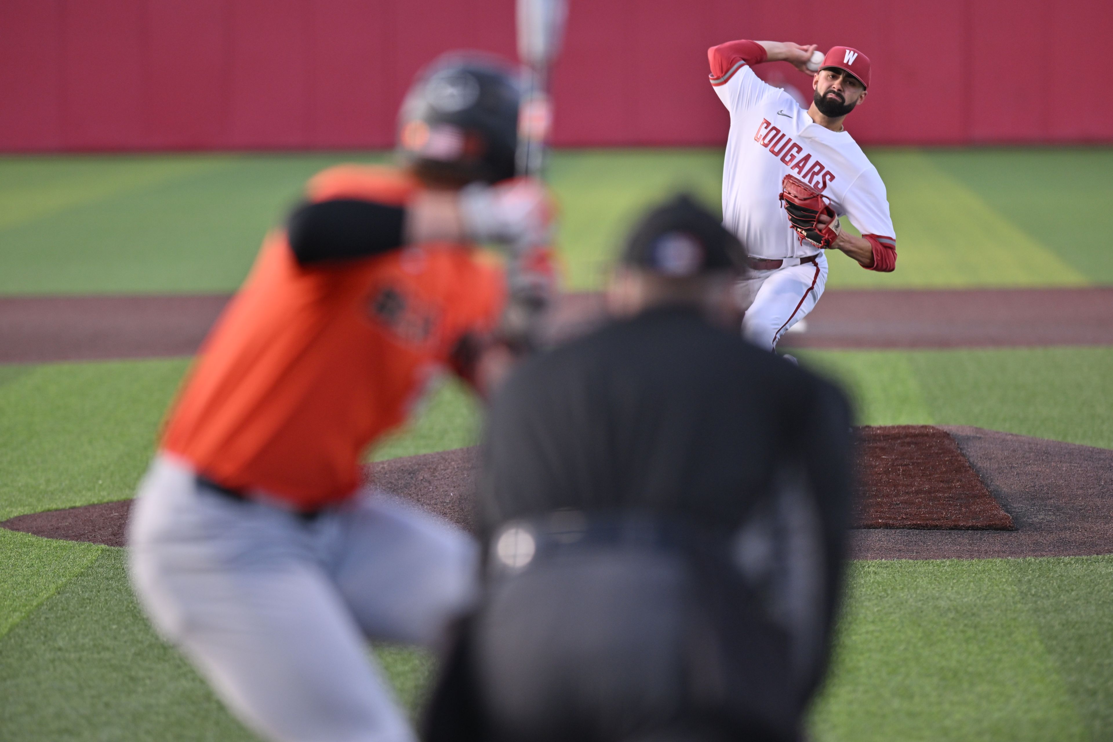 Washington State pitcher Grant Taylor throws a pitch to an Oregon State batter during a game Friday at Bailey-Brayton Field in Pullman.