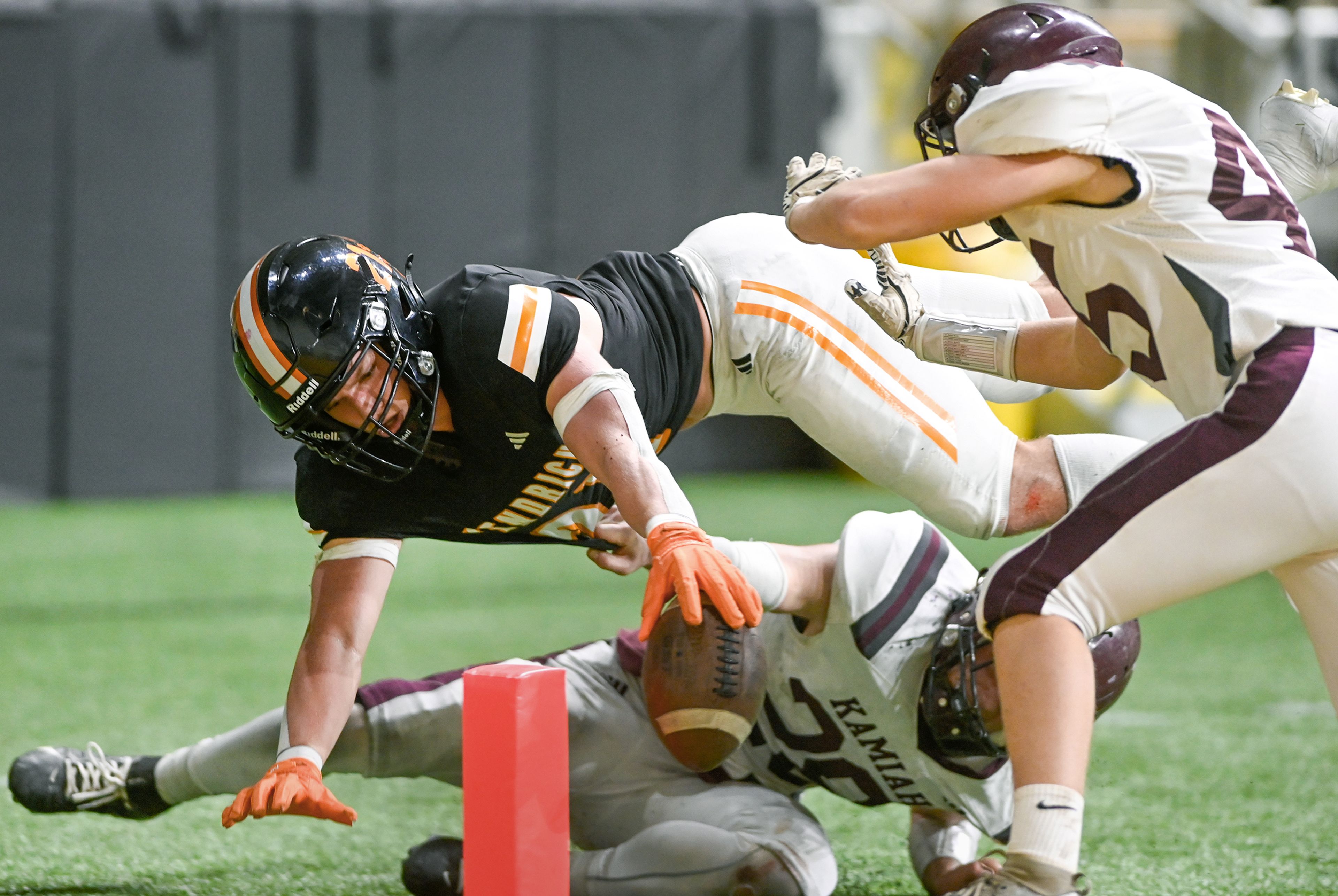 Kendrick’s Nathan Kimberling dives over the pylon for a touchdown against Kamiah in the fourth quarter of an Idaho Class 2A state quarterfinal game at the P1FCU Kibbie Dome in Moscow.