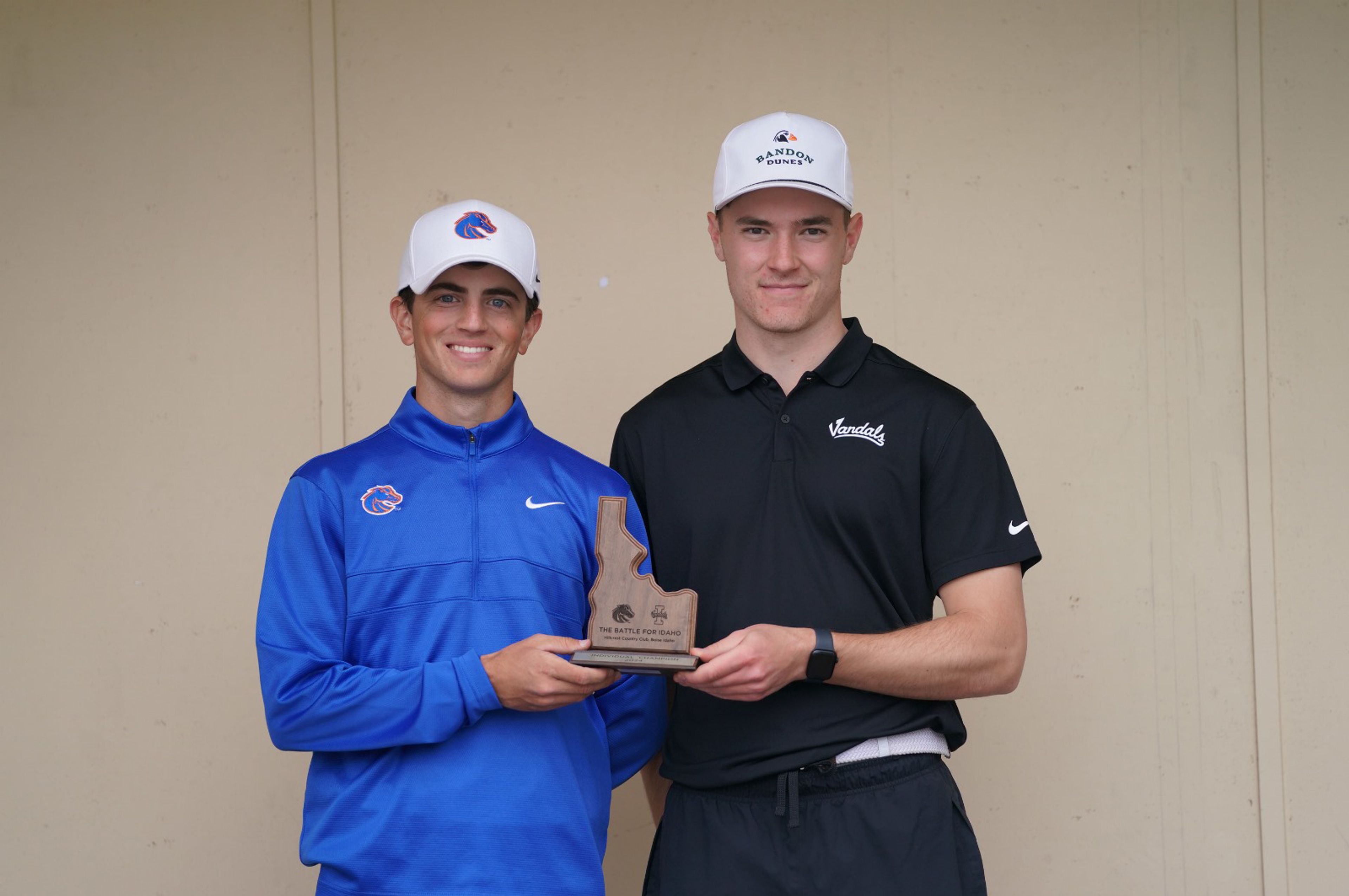 Boise State's Cole Ruech, left, and Idaho's Joe Sykes share the first-place trophy for the inaugural Battle For Idaho golf dual Tuesday at Hillcrest Country Club in Boise.